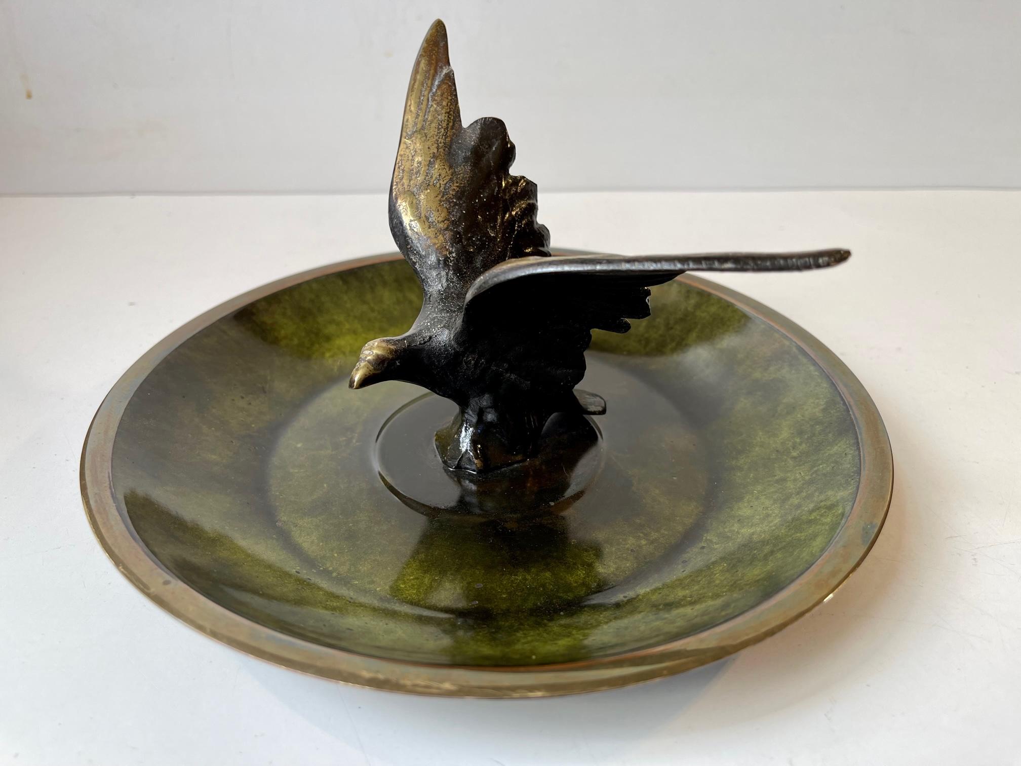 Bronze bowl with applied verdigris patina (cold paint) in diffrent 'green's'. Sculptural center figurine in shape of an eagle. It was designed and manufactured in Denmark during the 1930s or 40s. Marked bronze and signed indistinguishable.