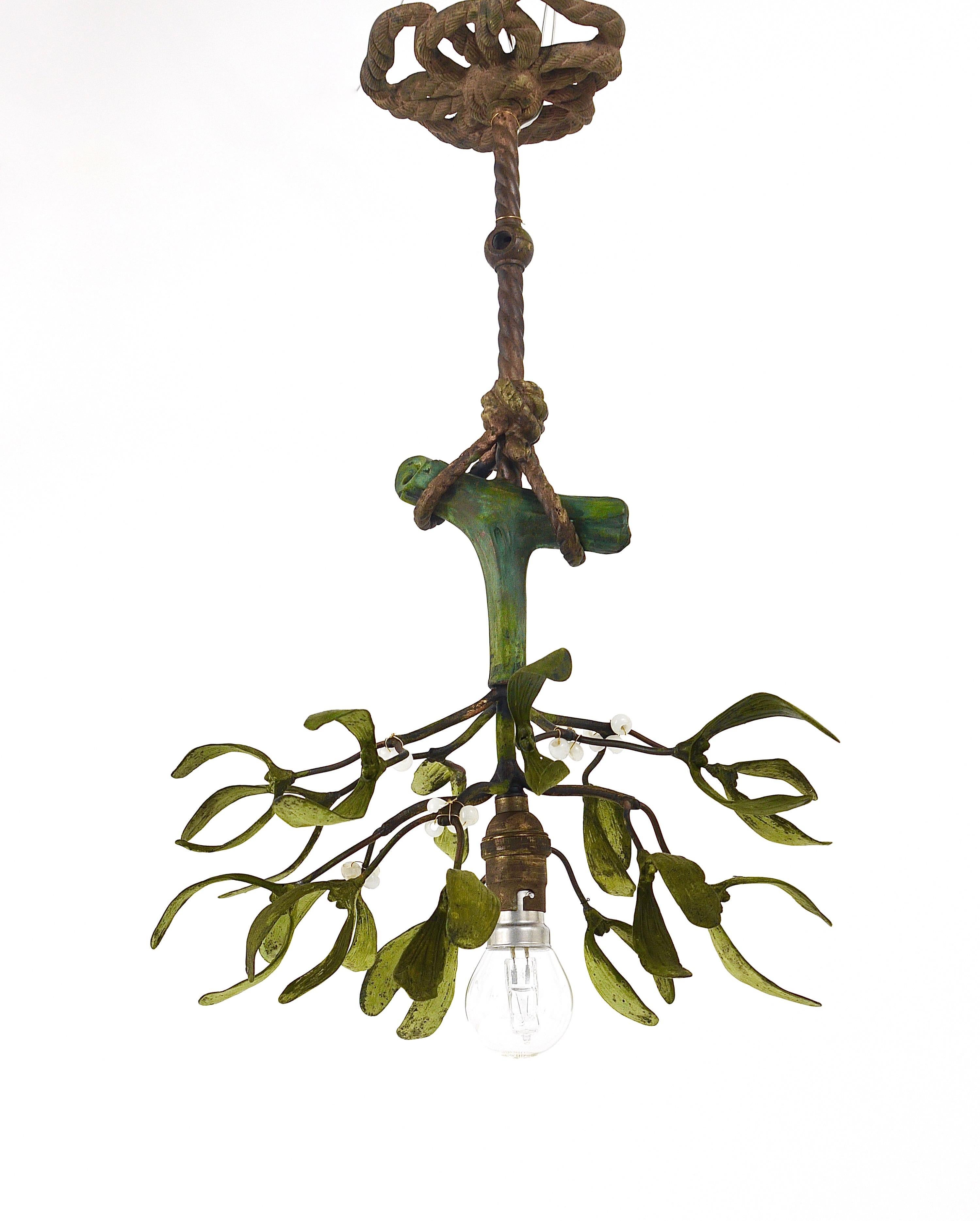 A beautiful French Art Nouveau mistletoe chandelier light fixture from the 1920s. Made of bronze, hand painted, the berries are made of opaline glass. In very good condition.