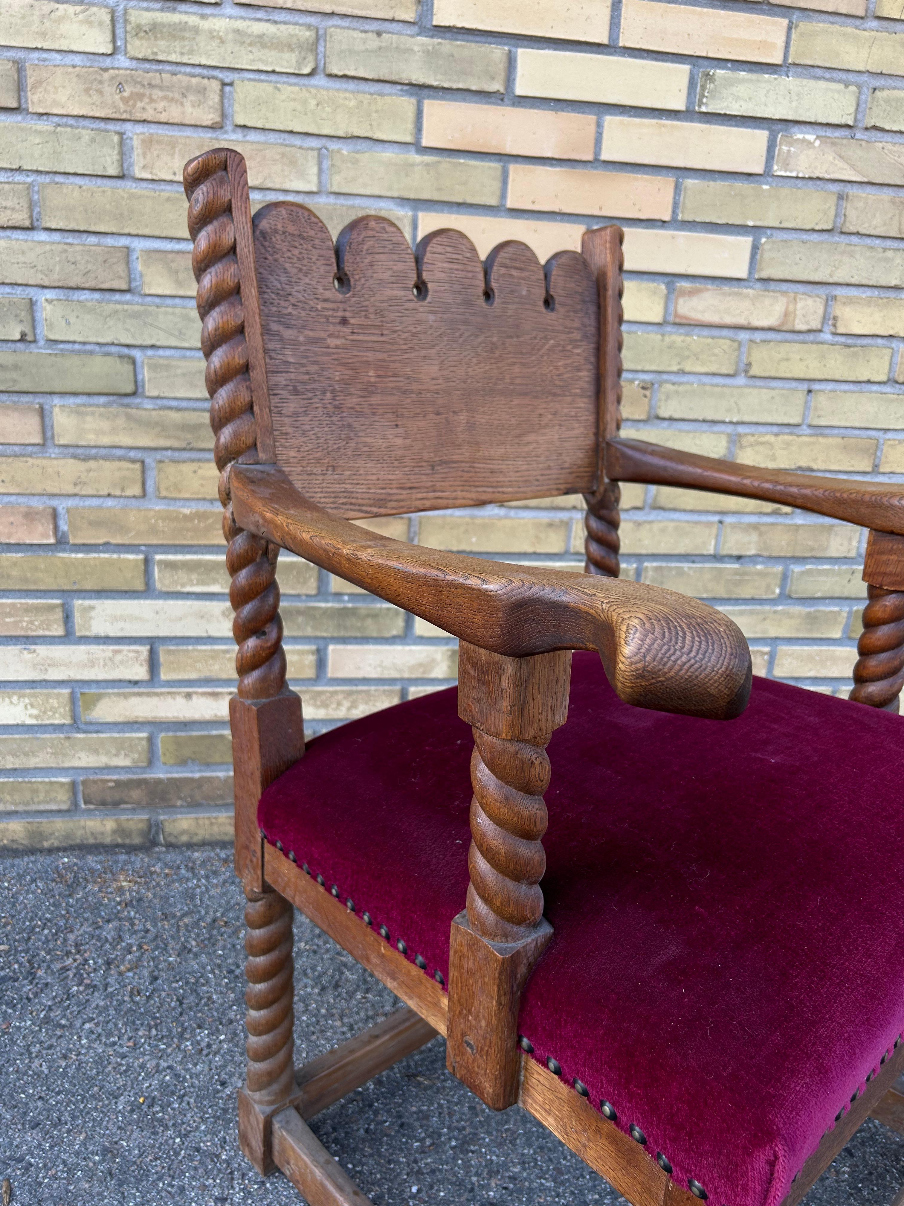 Rare decorative sculptural arts and crafts solid oak arm chair with original velvet upholstery with brass nails to hold the upholstery.
The chair is made by a unknown Danish craftsman in solid oak in the 1920’s.
The chair is the perfect decorative