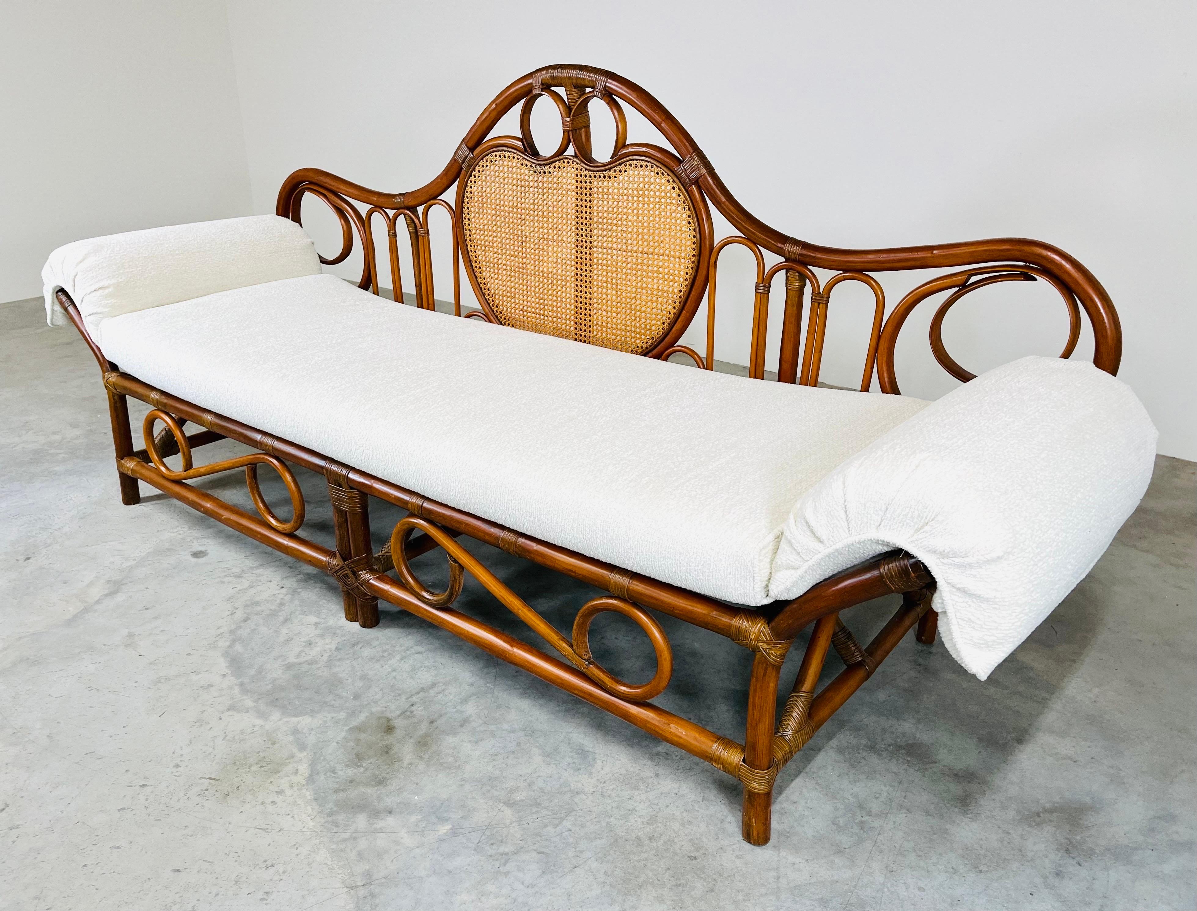 Sculptural Bamboo Daybed Chaise
Attributed to Tommi Parzinger
Extremely stylish bamboo daybed, chaise lounge attributed to Tommi Parzinger for Willow Reed Furniture. The sofa chaise comes with the cushion shown which is formed to curl over the