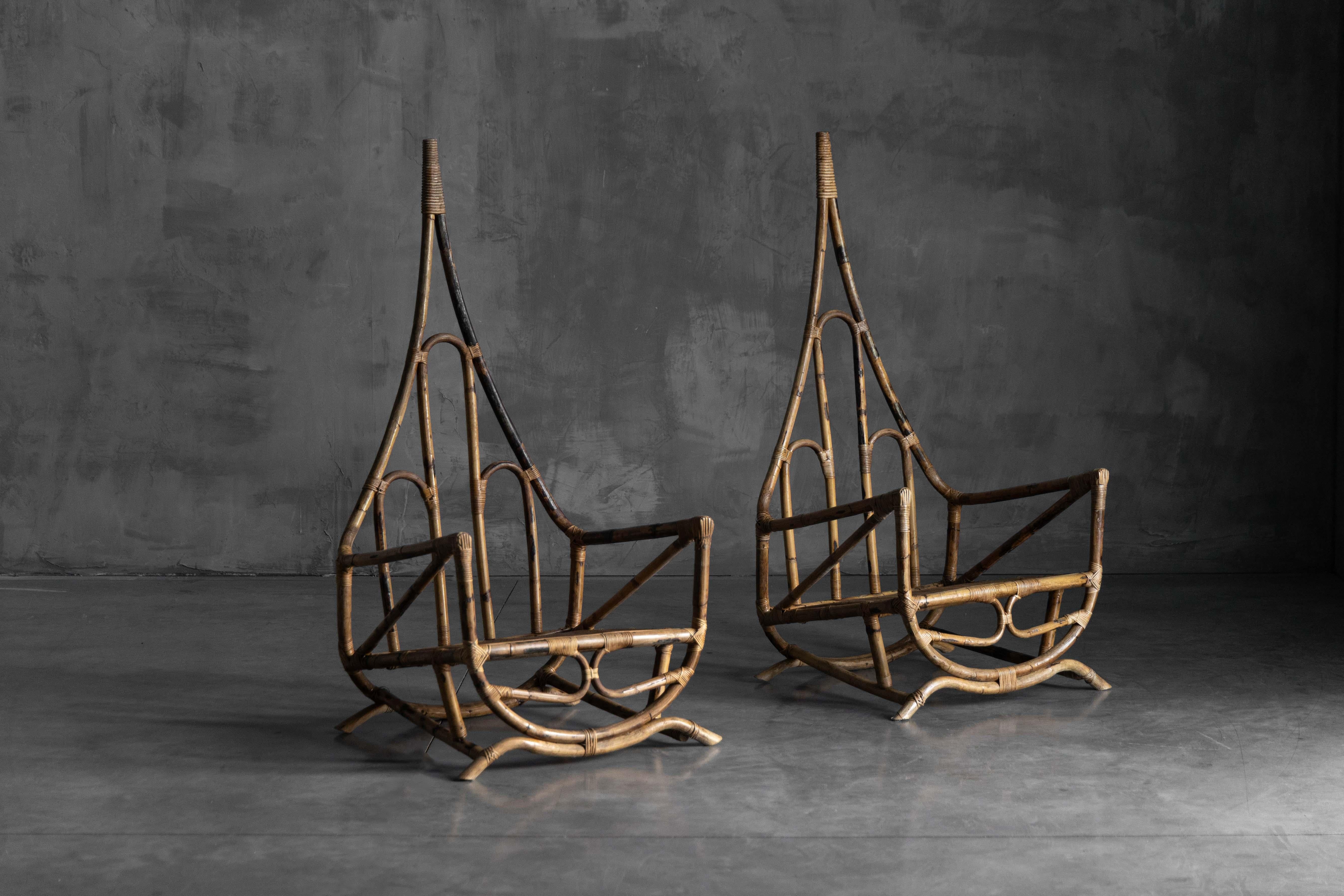 Striking sculptural bamboo lounge chair, designed in Italy in the mid-20th century, showcasing a rare and expressive silhouette with a soaring backrest. Handcrafted from richly patinated bamboo and bound with rattan cane at the joints, the chair’s