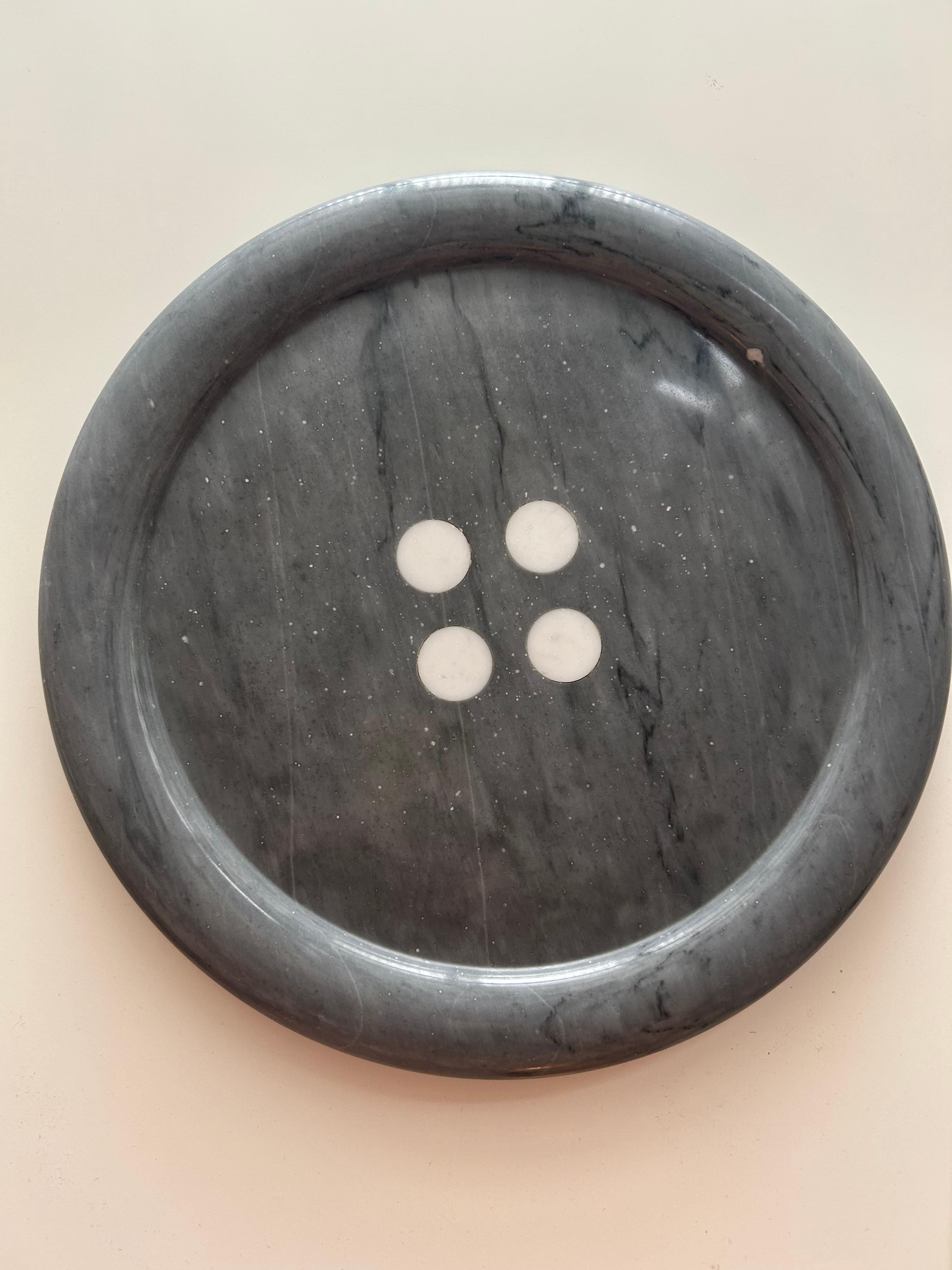 Sculptural Bardiglio Marble Centerpiece with Central Button - Casigliani

A piece that transcends function to become a domestic sculpture. Crafted in exquisite grey Bardiglio marble, celebrated for its elegant veining and tactile presence, this
