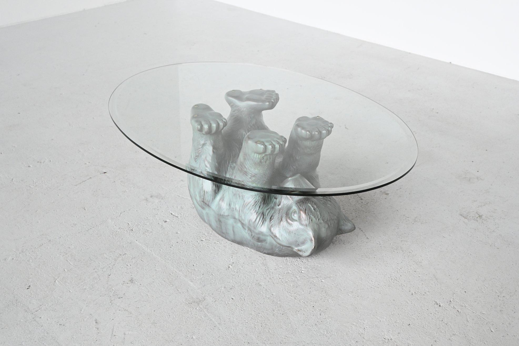 Very nice bear coffee table in Hollywood Regency style, Belgium, 1970. This sculptural coffee table is very detailed made of and has a nice green color. The base is made of moulded copper which supporting an oval glass table top. This coffee table
