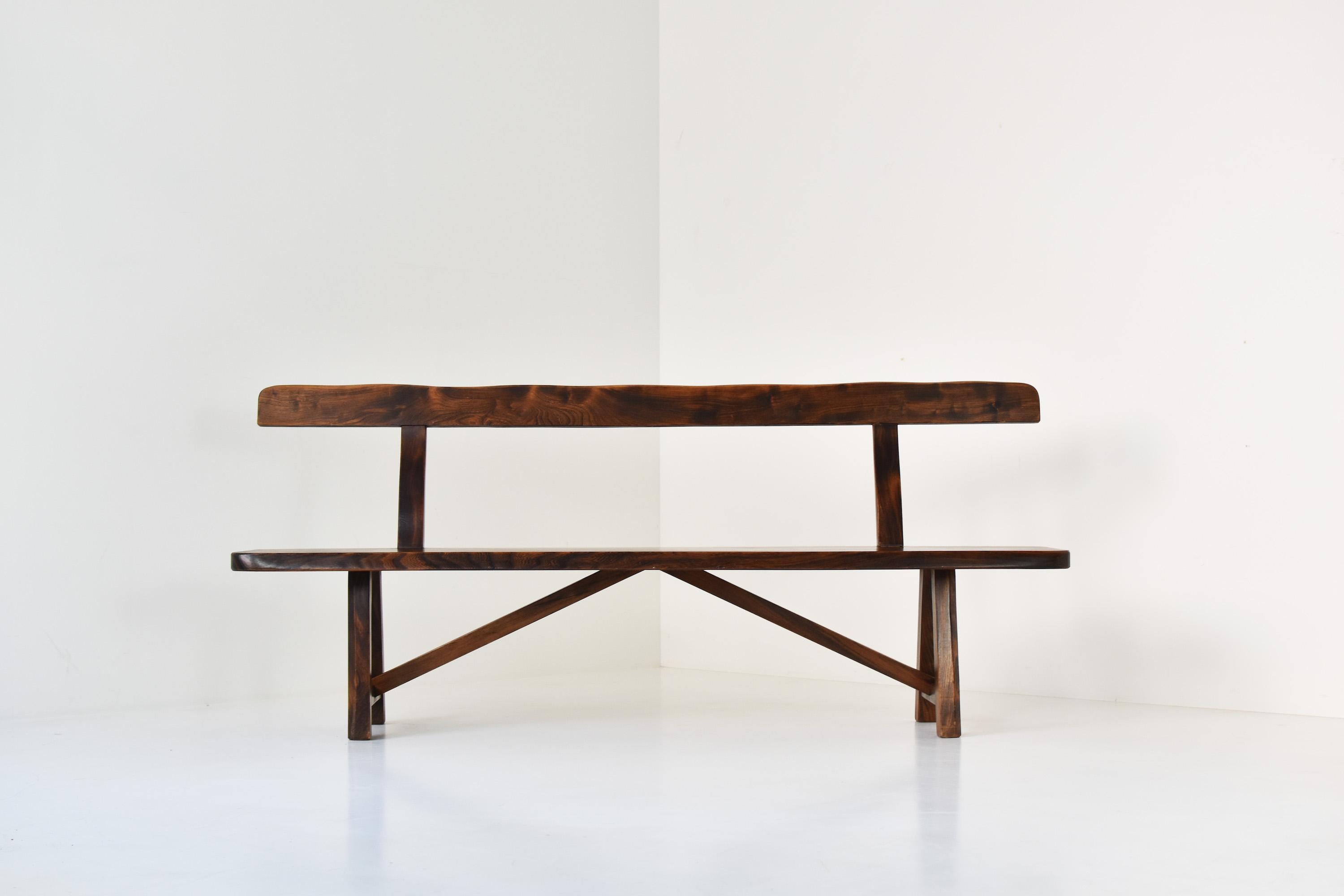 Sculptural bench by Olavi Hanninen for Mikko Nupponen, Finland 1950’s. This bench is made of stained elm wood and sculpturally crafted by hand. Very well presented original condition.