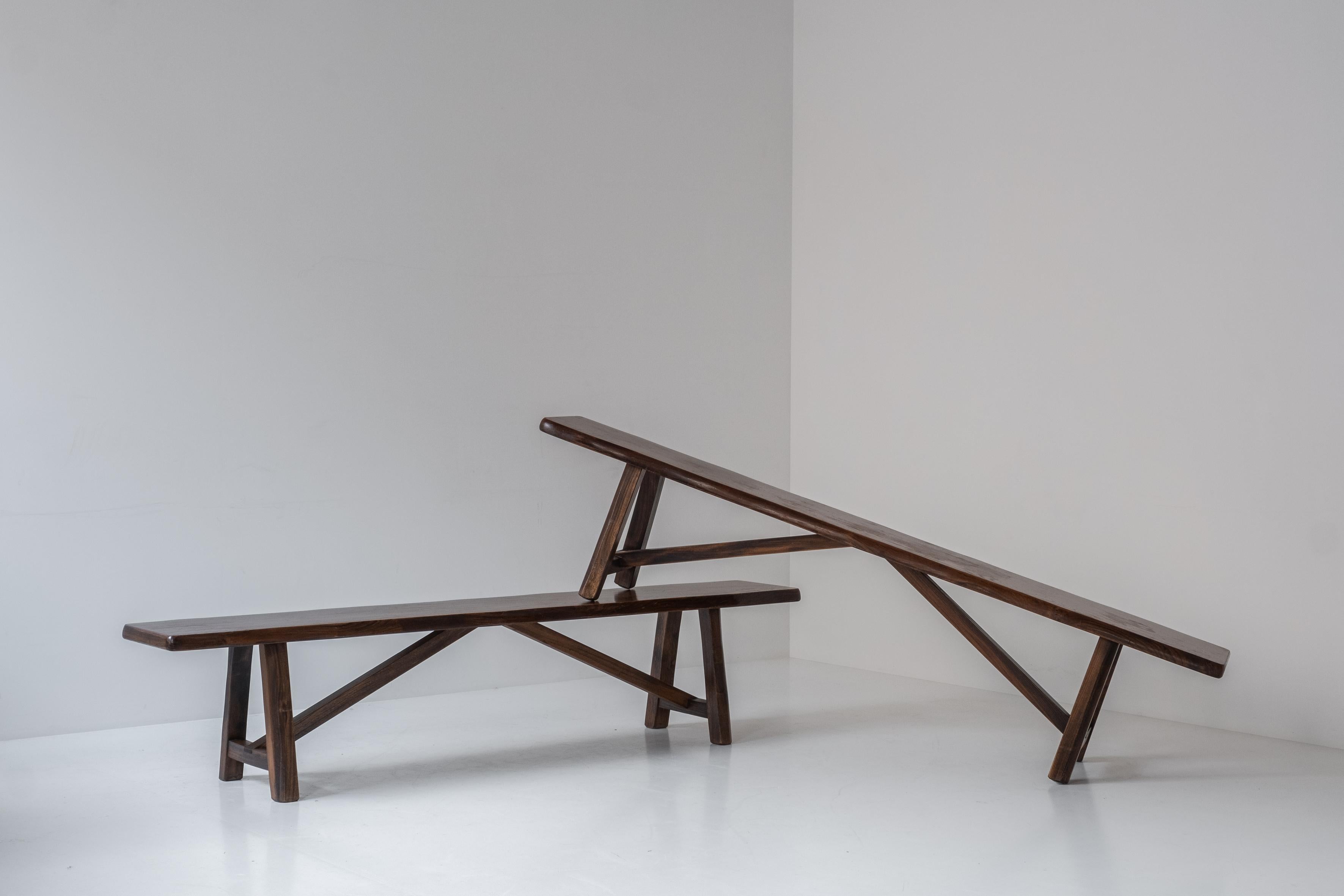 Sculptural bench by Olavi Hanninen for Mikko Nupponen, Finland 1950’s. This bench is made of stained elm wood and sculpturally crafted by hand. Presented in a good, original, condition. We have two identical pieces available. Sold and priced per
