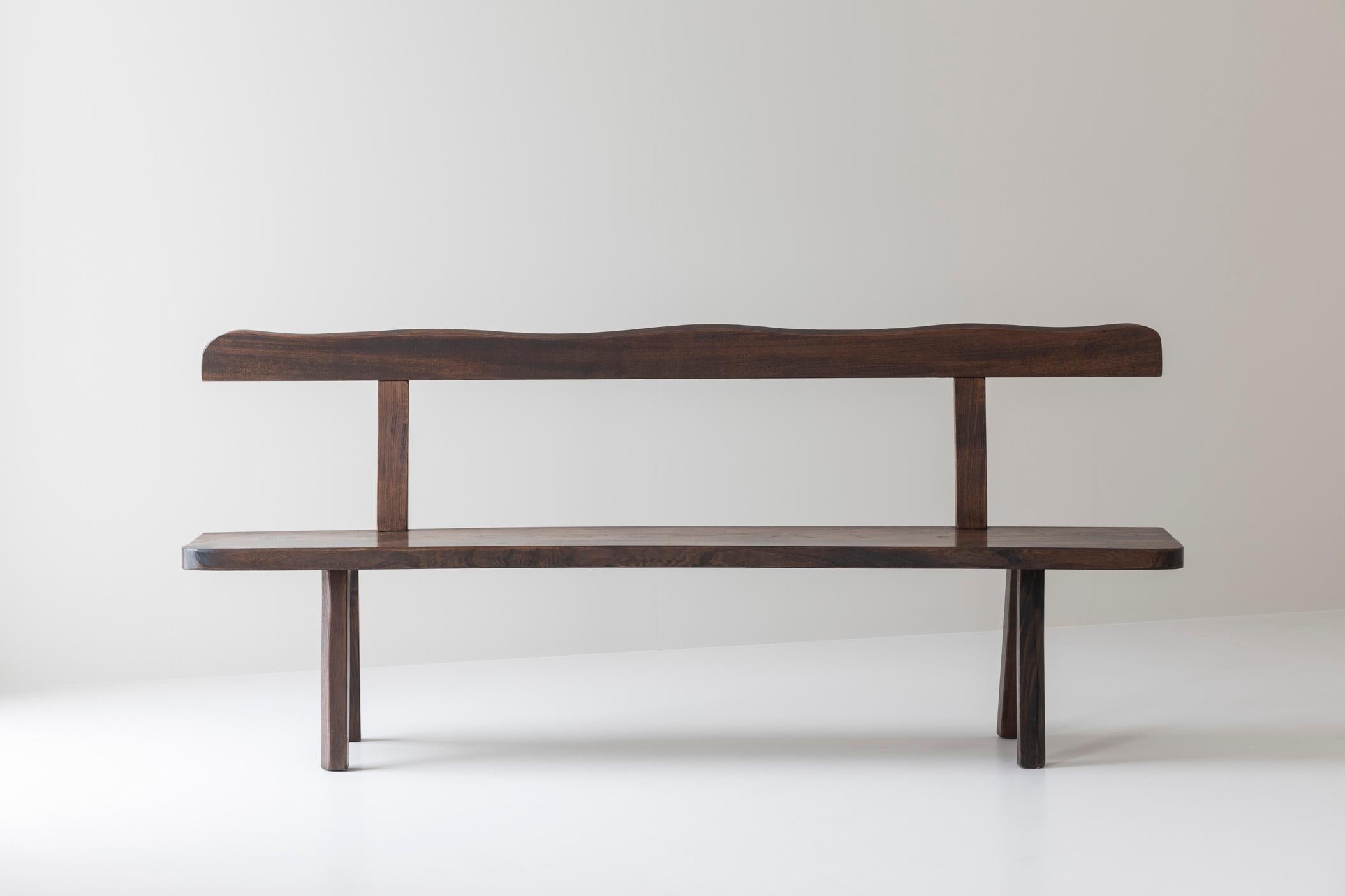 Sculptural bench by Olavi Hanninen for Mikko Nupponen, Finland 1950’s. This bench is made of stained elm wood and sculpturally crafted by hand. Presented in a good, original, condition. 