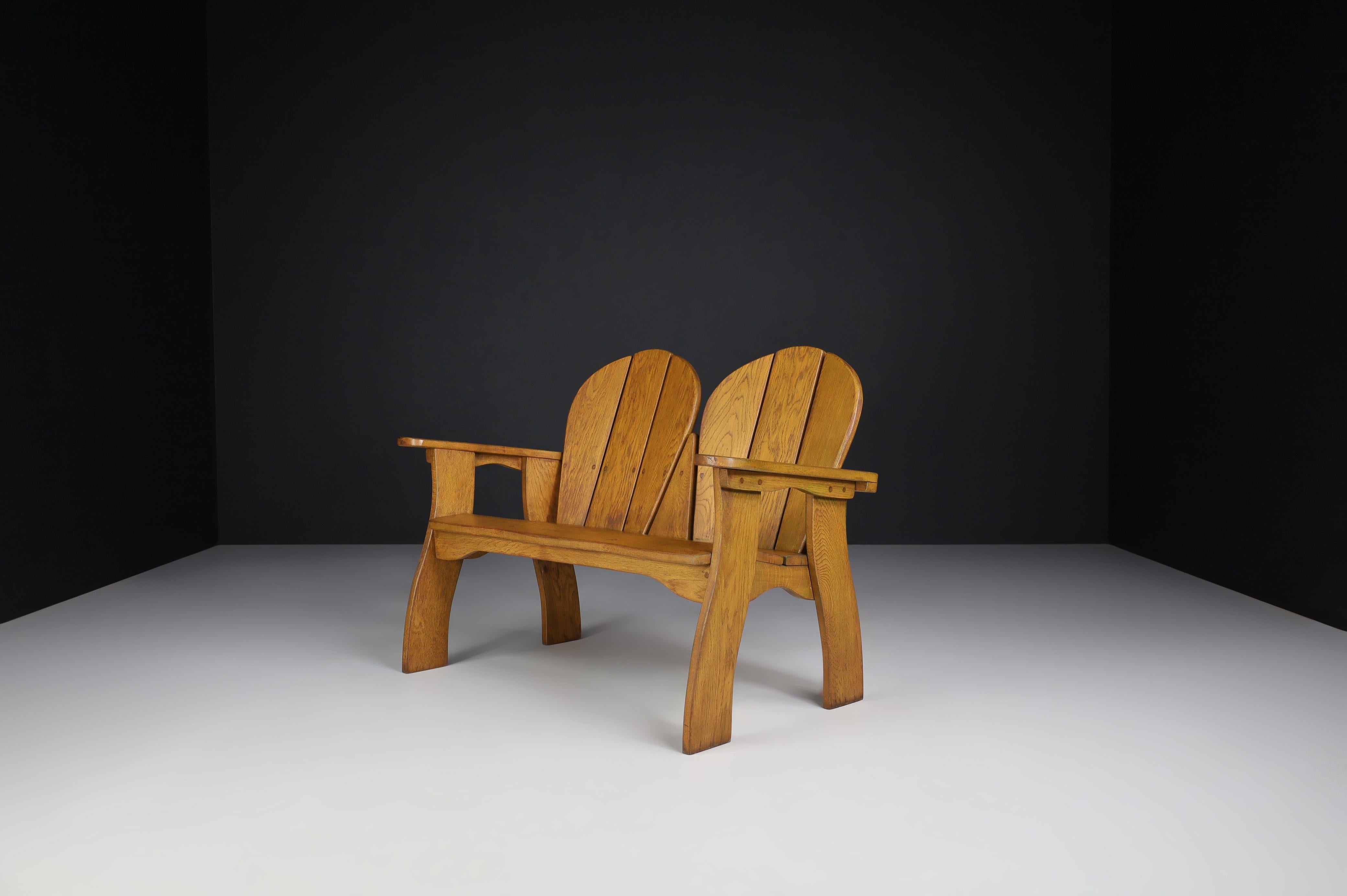 Sculptural bench in oak, France, 1960s. 

Oak sculptural bench, this lovely settee is made of French oak and sculpturally crafted by hand in France in the 1960s. The craftsmanship is still visible; they are made of solid oak wood and constructed