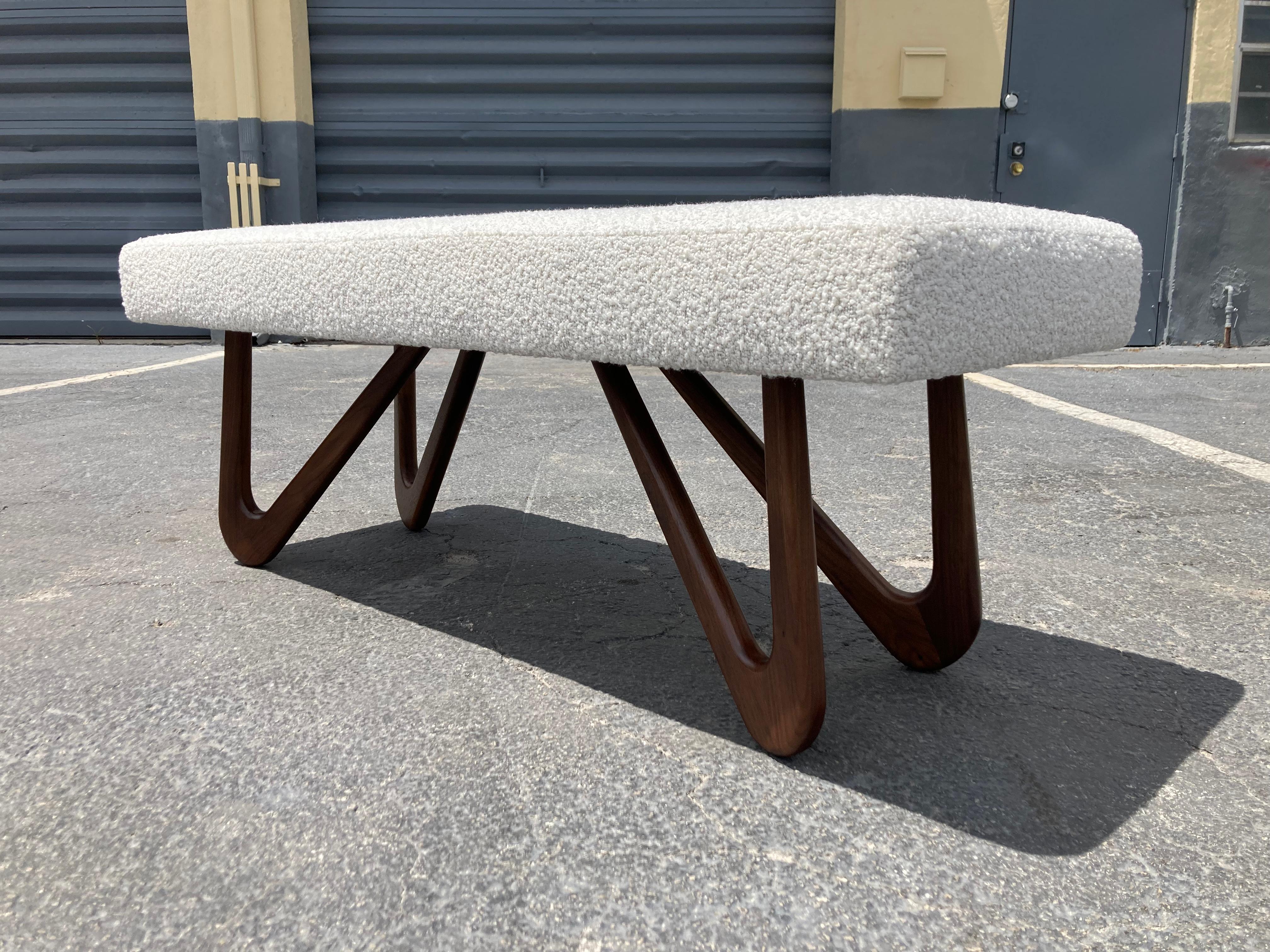 Sculptural bench, solid Walnut legs and new Boucle fabric. Two benches available. Ready for a new home. Made in the USA.