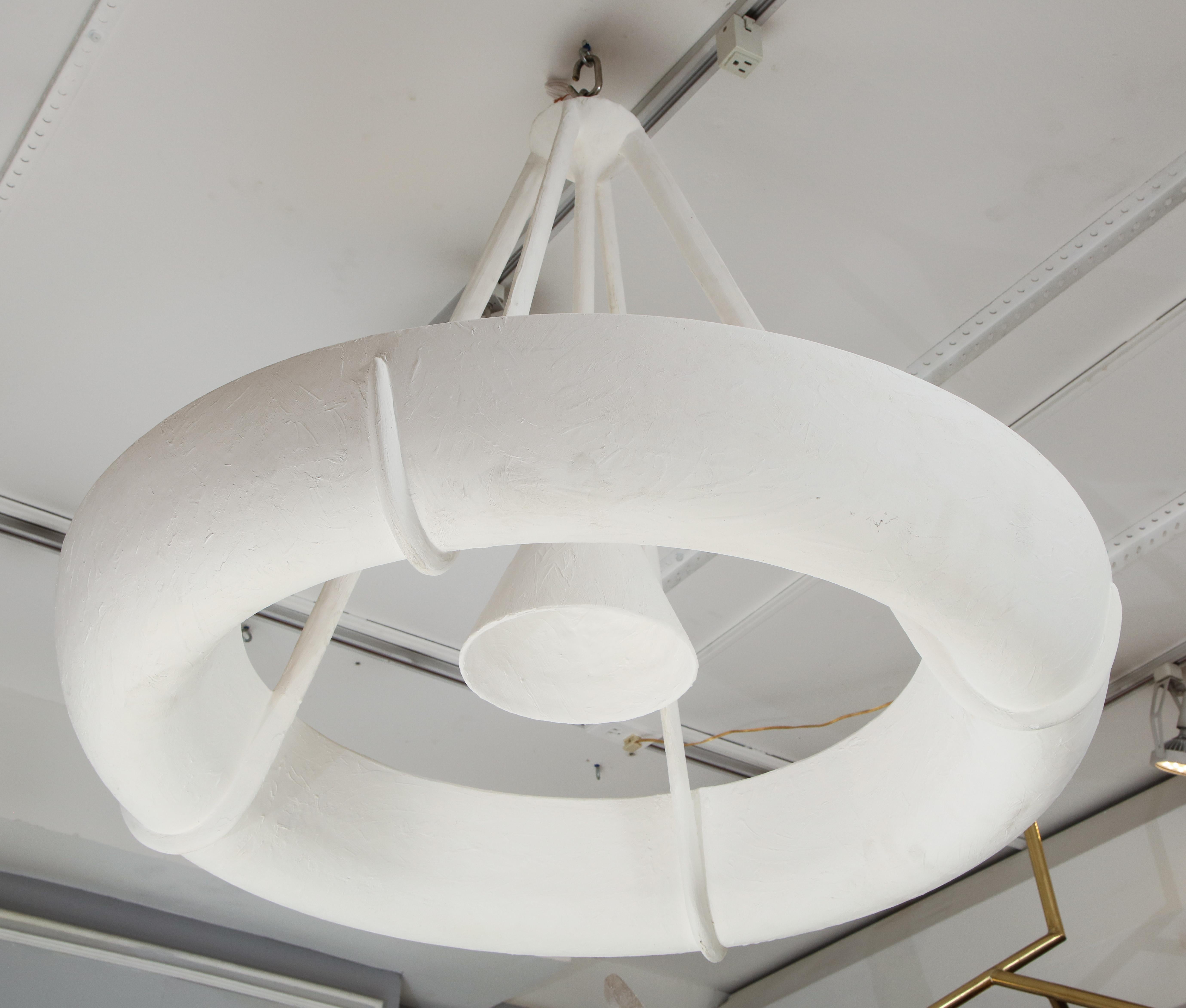 Sculptural Bespoke Plaster Fixture in the Jean Michel Frank manner.
Please note that this fixture takes (1) Edison bulb at 40 or 60 watts in the center and (8) e-12 candelabra bulbs at 40 watts each in the interior (8) sockets = 320 watts inside the