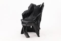 Skulpturaler Sessel aus schwarzem verkohltem Holz in organischer Form von Logniture