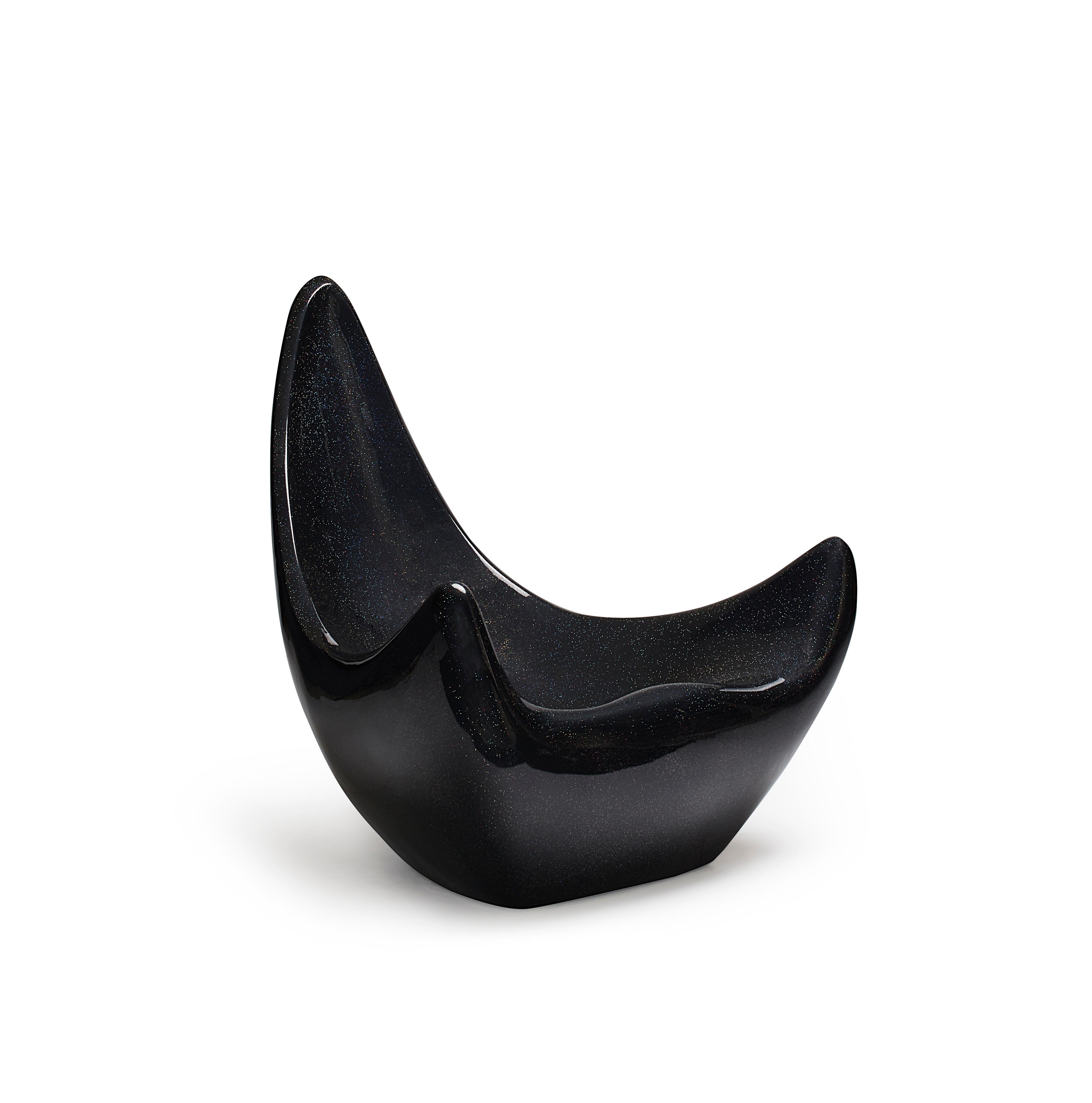 Contemporary, hand sculpted fiberglass armchair - Popcorn Armchair by Kunaal Kyhaan. The sensual form, is imagined in a Galaxy finish with a unique composition of gloss black,  iridescent glitter and stardust mica fragments to recreate the