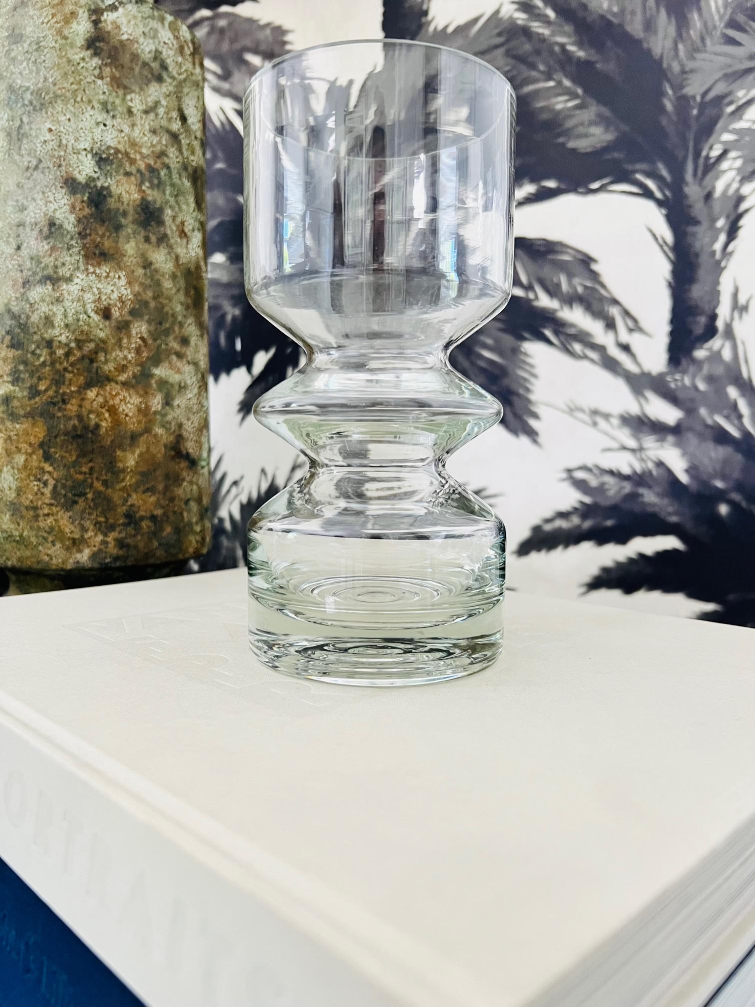 Mid-Century Modern blown glass vase with sculptural form features a hooped center with a tapered base design. Designed by Tamara Aladin for the iconic Riihimäen Glass company of Finland. Riihimäen Glass was in production from 1910-1990, and are