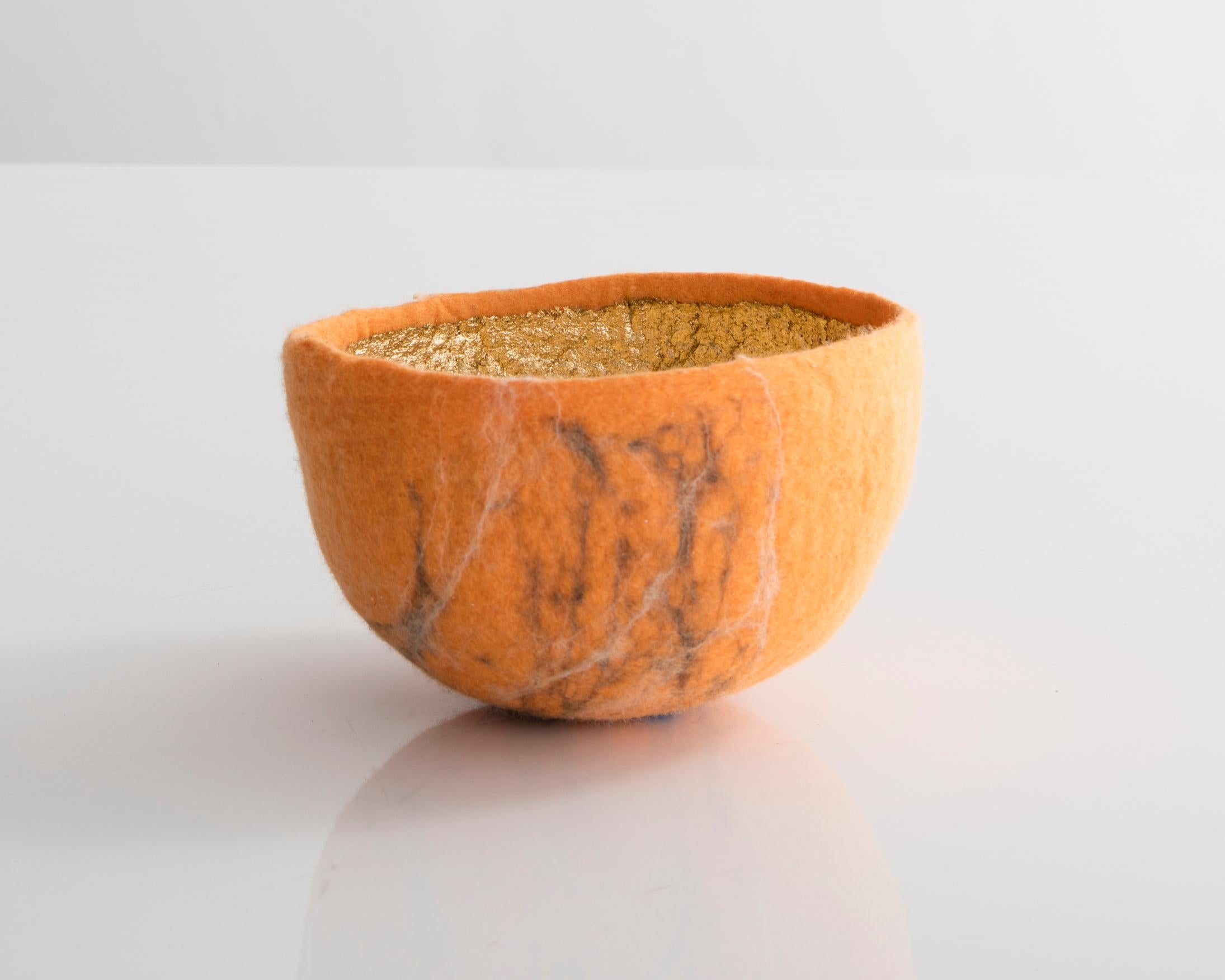 Sculptural bowl in orange and gold metallic felt. Designed and made by Ronel Jordaan, South Africa, 2016.