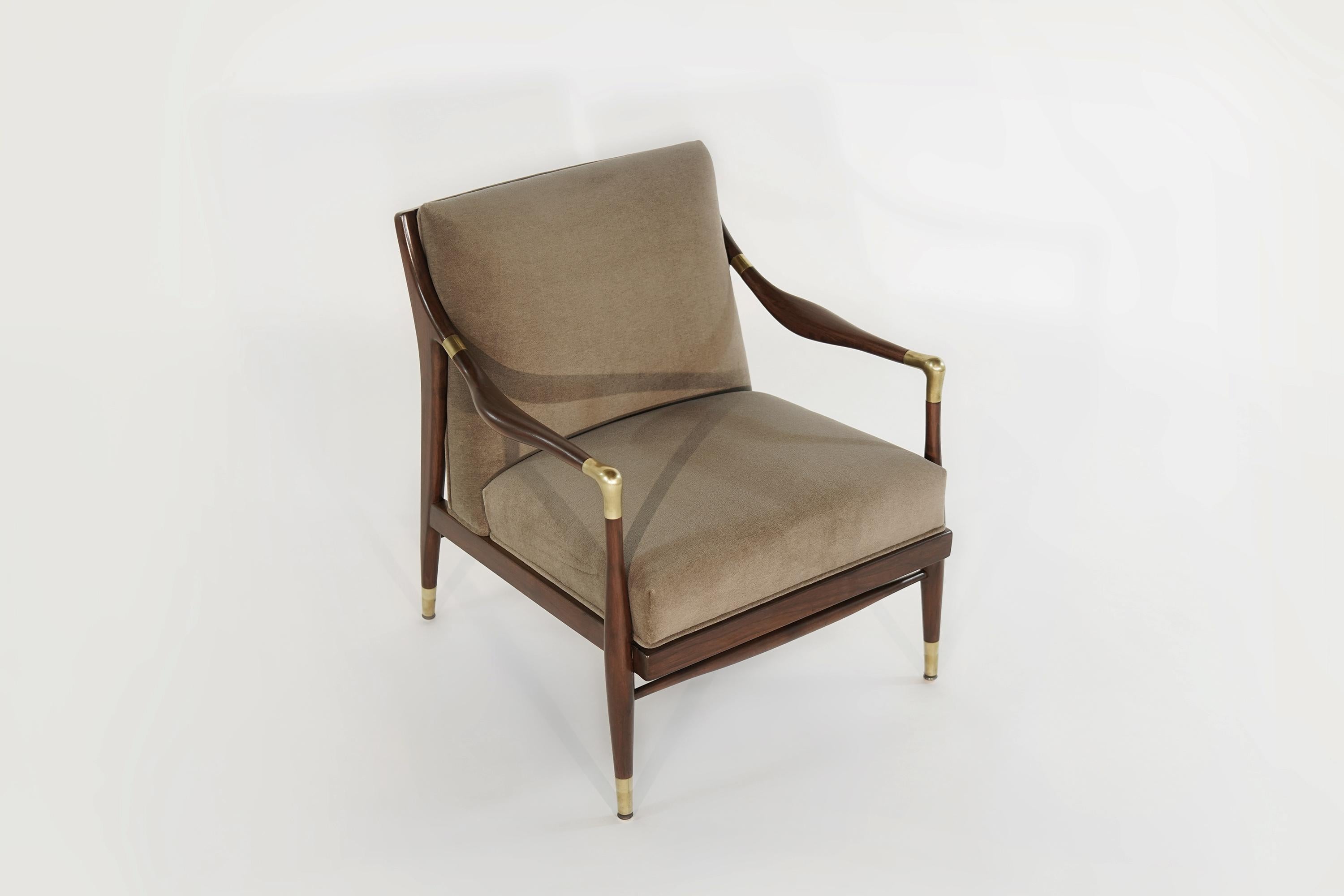 Sculptural lounge chair featuring brass accents on arms and sabots produced, by Jamestown Royal, 1950s.

Walnut frames fully restored, reupholstered in chocolate mohair by Holl Hunt.