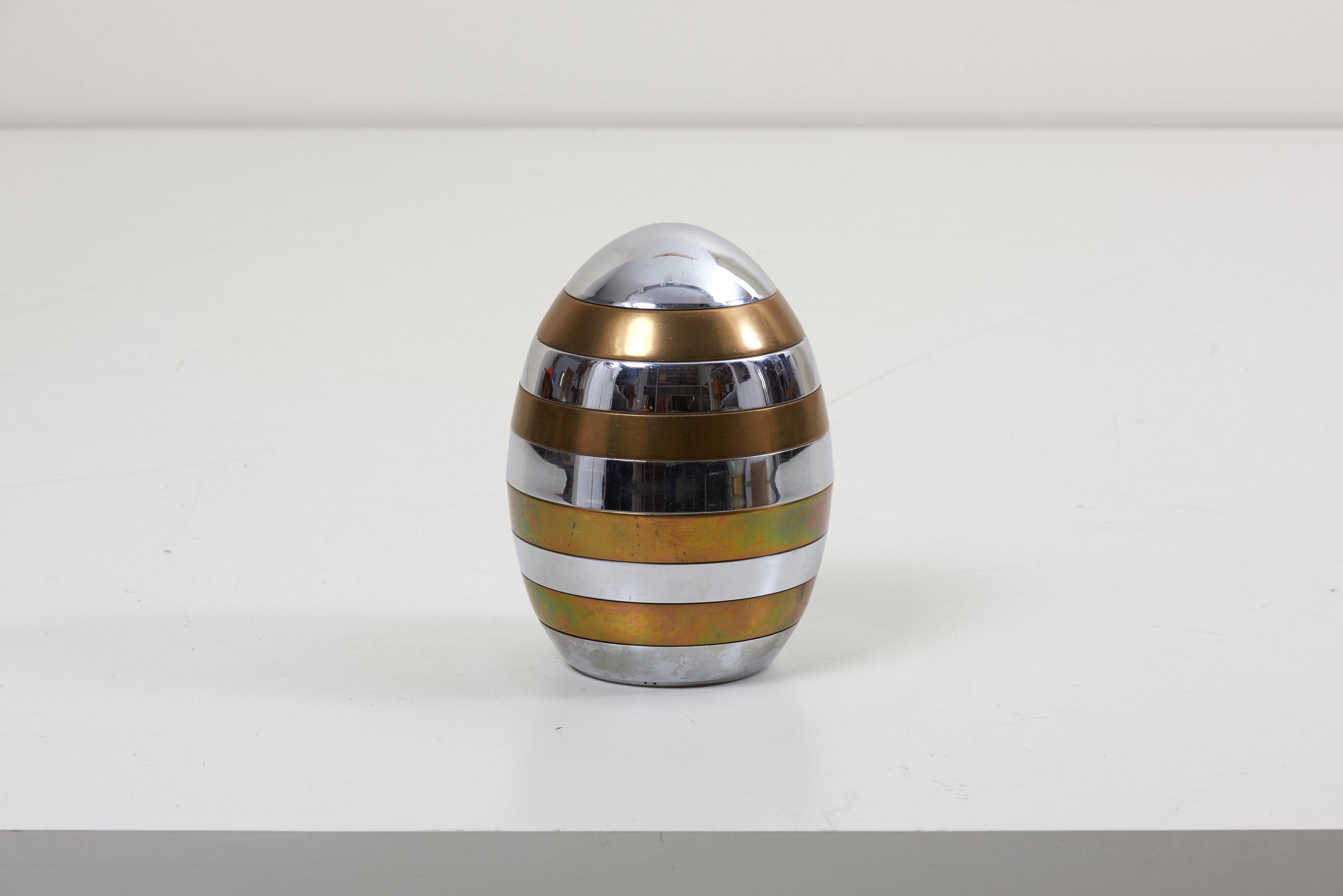 Very nice brass and chrome stacking tray in the shape of an egg. The egg is from the 1970s and labeled by Tommaso Barbi.
