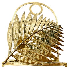 Portariviste scultoreo in ottone fuso