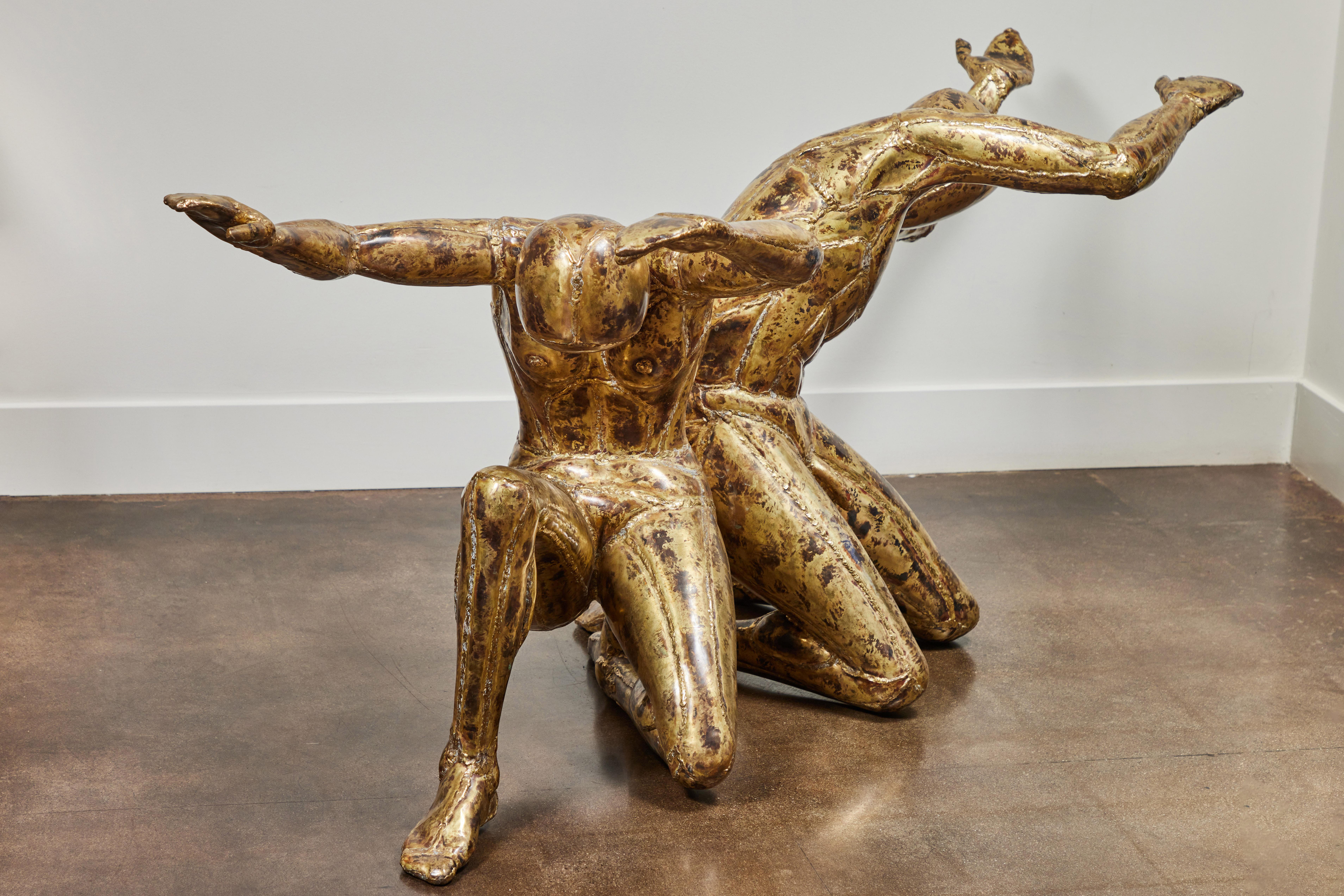 Rare and fantastic brass table base in the form of two kneeling human figures by French artist Jacques Duval-Brasseur, 1970's, titles 