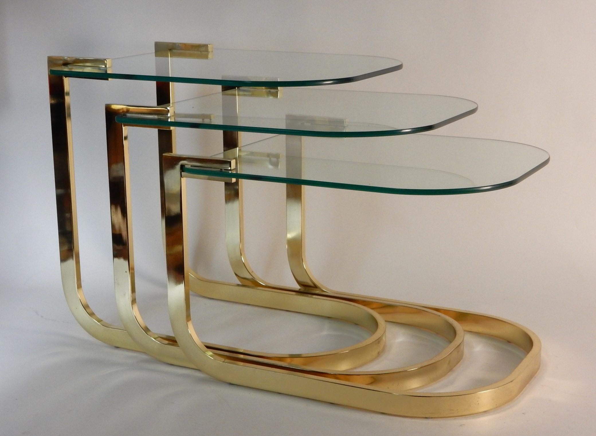 Hollywood Regency Sculptural Brass Nesting Table Set with Cantilever Glass Tops For Sale