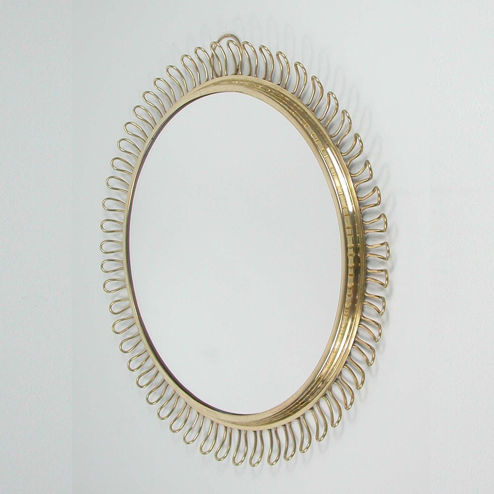 Swedish Sculptural Brass round Wall Mirror by Josef Frank Svenskt Tenn, Sweden, 1950s