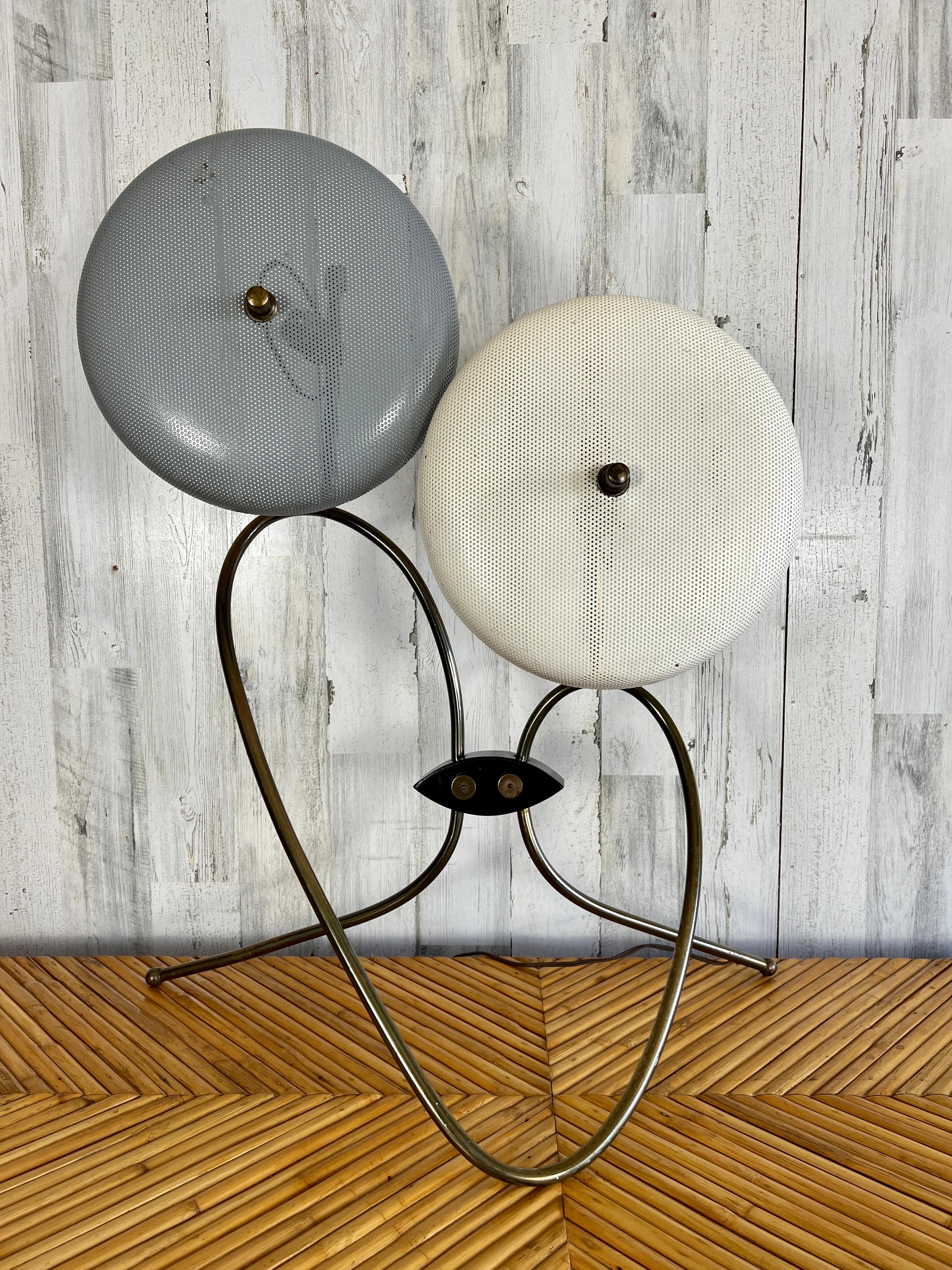 Perforated metal shades on this twisted brass table lamp base.
