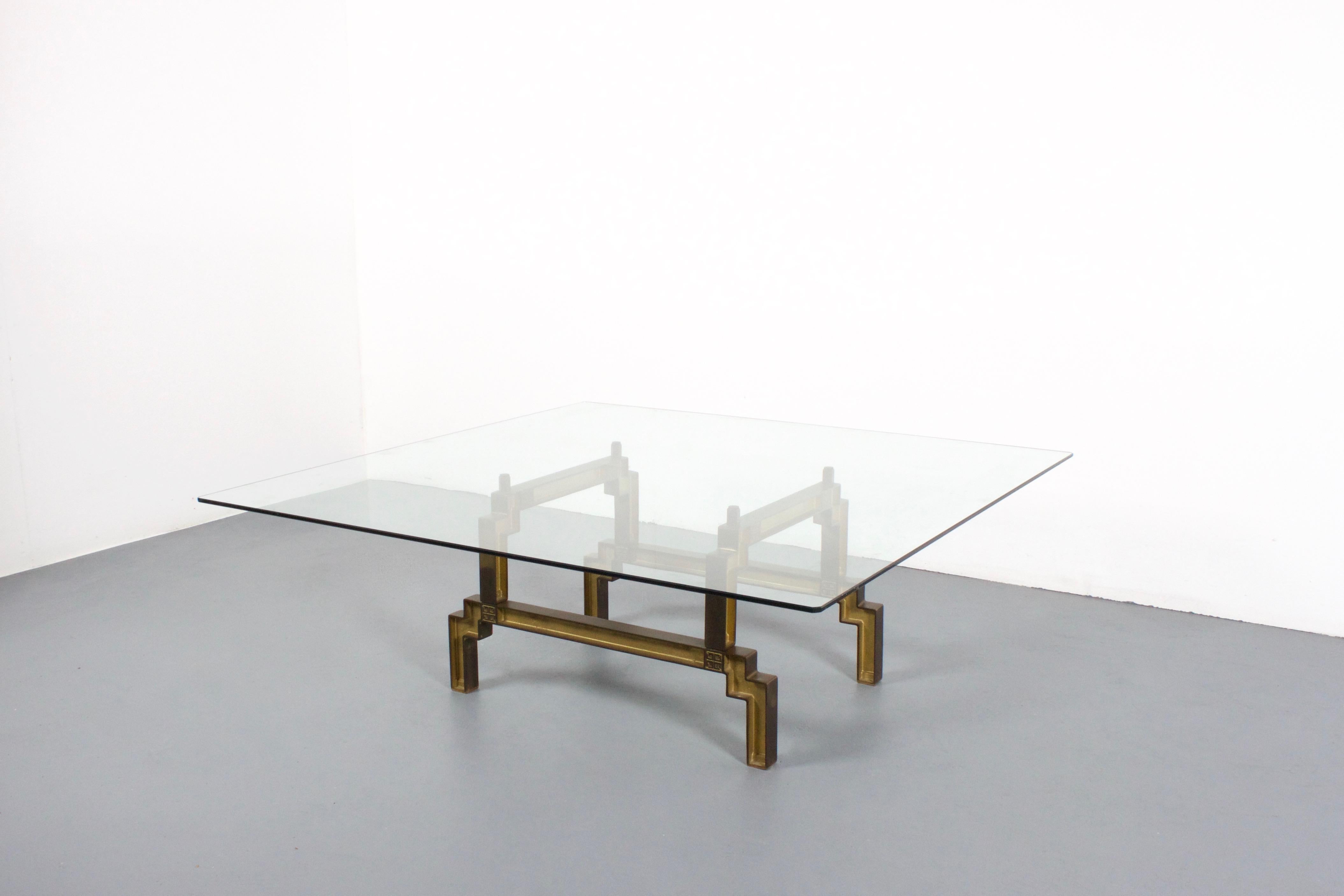 Rare Peter Ghyczy coffee table in very good condition. 

Made of solid bronze with a glass top. 

This table has been produced in very limited quantities.

Each leg features the Ghyczy logo. 

We offer a variety of insured shipping services, ask us