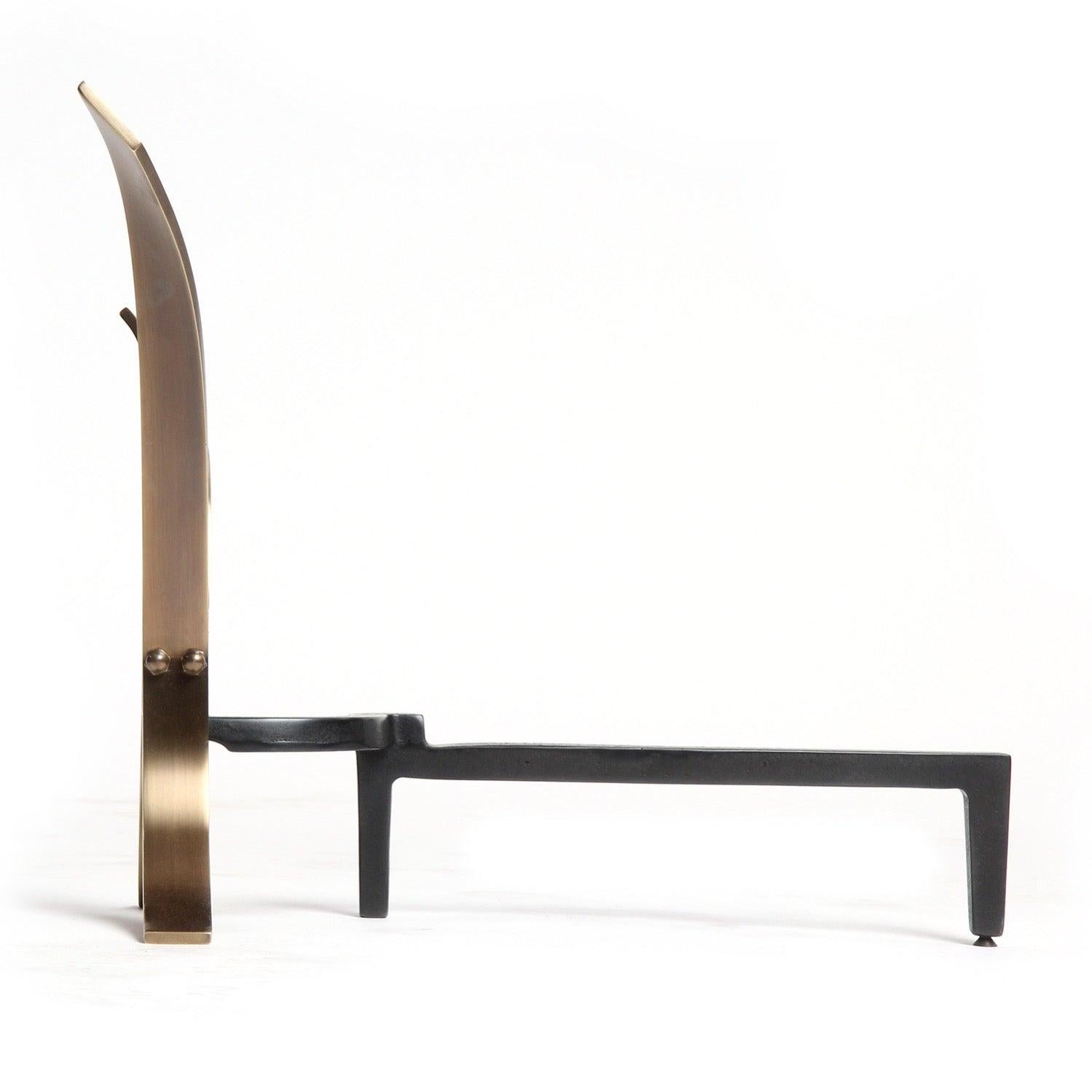 A sculptural pair of polished bronze andirons made from conjoined flaring and twisting narrow planes of bronze attached to a blackened iron base.