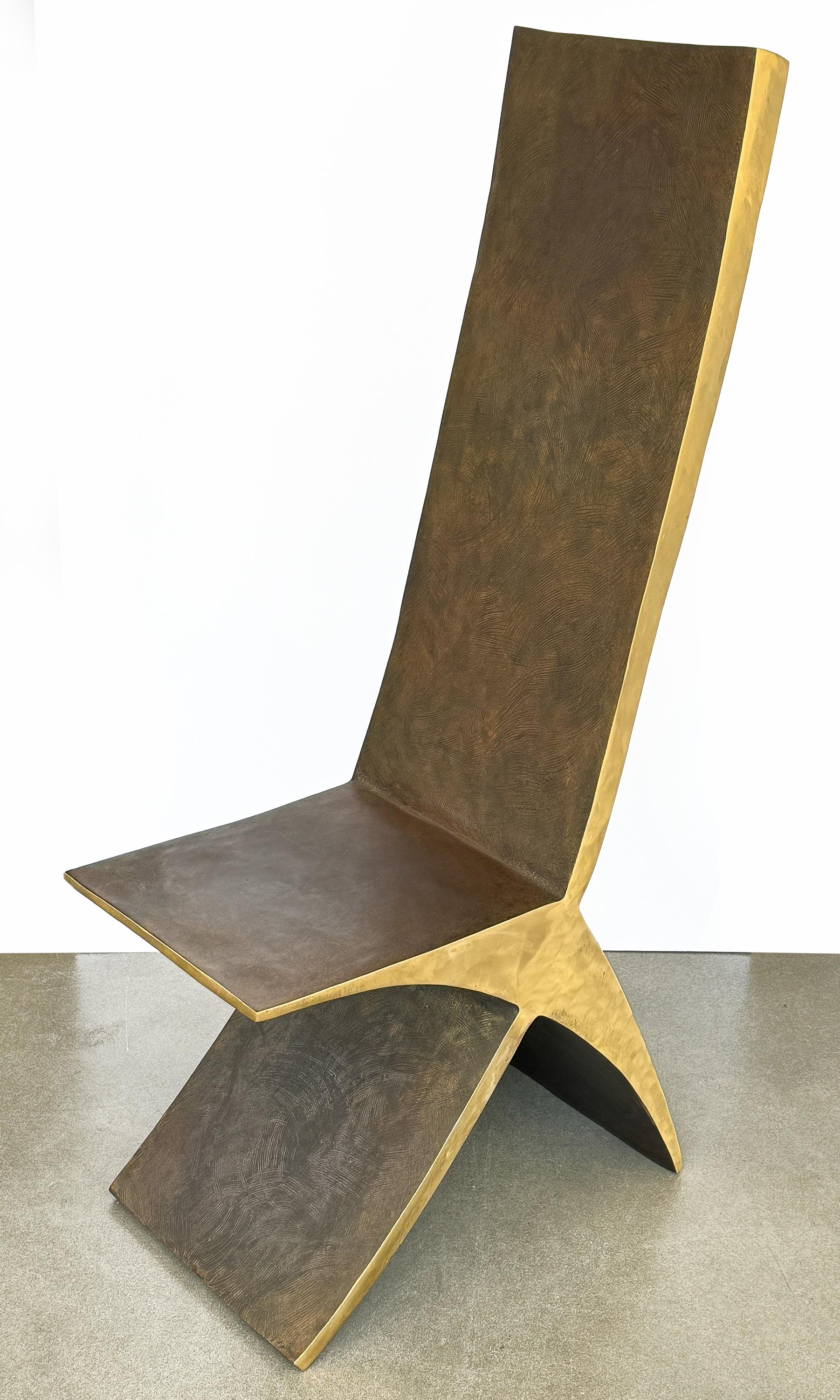 This sculptural bronze chair by American artist James Vilona (b. 1955), exemplifies modern minimalist artistry through its use of patinated bronze and simple yet striking X-form design. This chair isn't just a piece of furniture, but a work of art