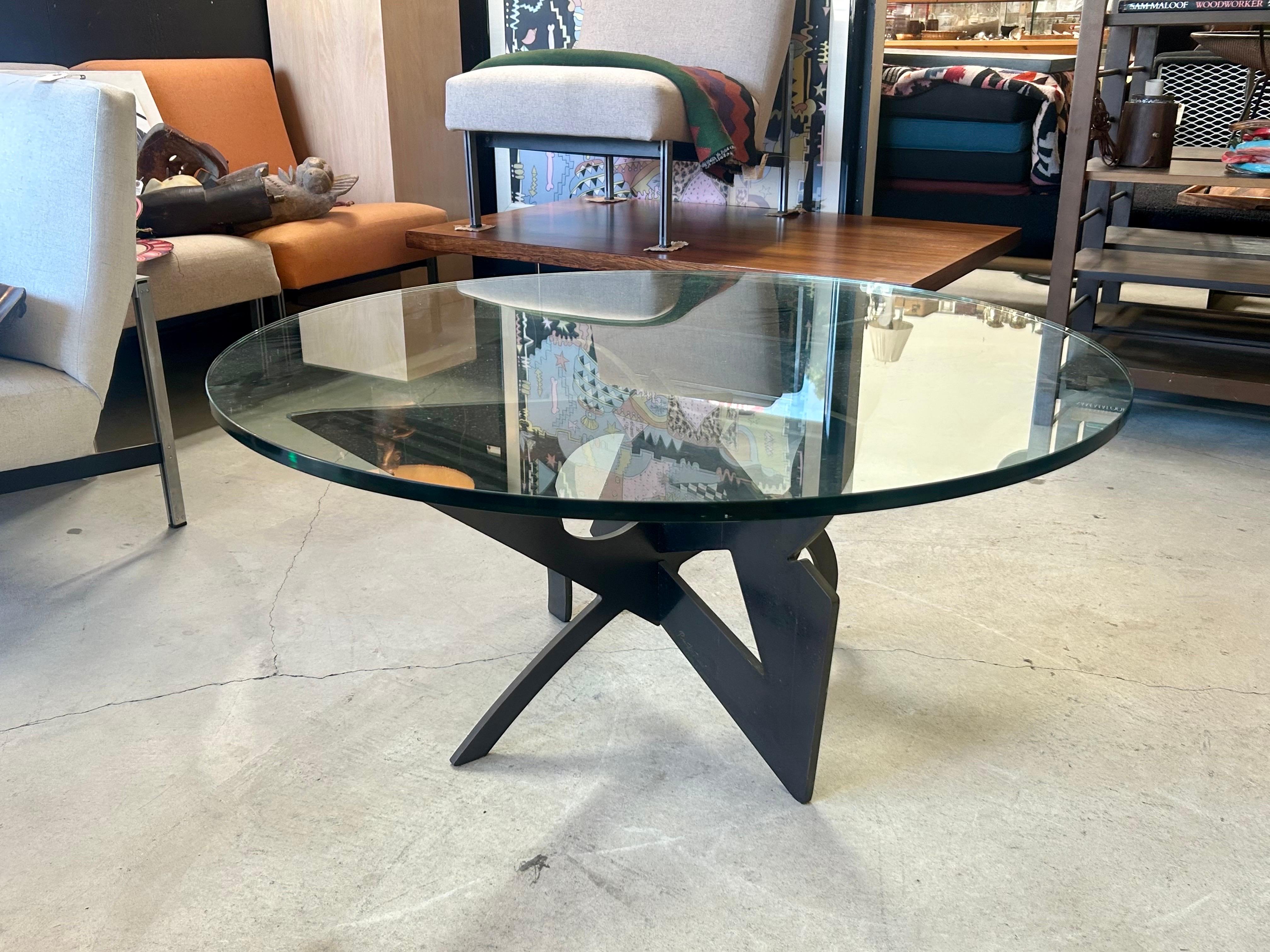 1947 - 2013
Mr. Rossi was an Italian artist designer.
His works are in collections and museums throughout Europe and the USA.
This table is a fine example of his unique style.
Limited.
Two pieces of bronze connected together like a puzzle with