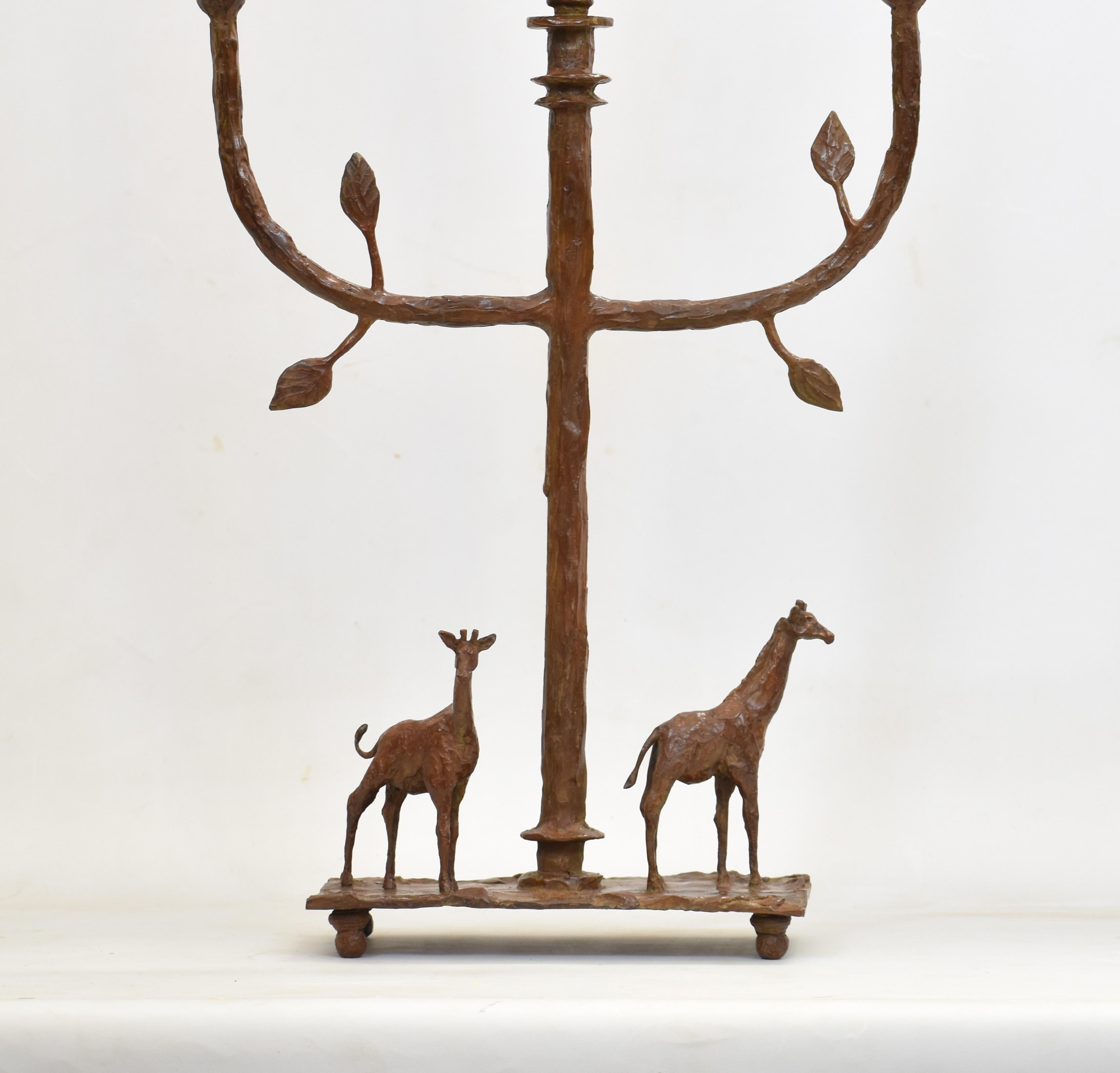 This handcrafted bronze candelabra celebrates the quiet elegance and harmony of Africa’s wildlife. Each piece is entirely original — no moulds are used at any stage. Every giraffe and decorative element is individually wax-modelled by hand, ensuring