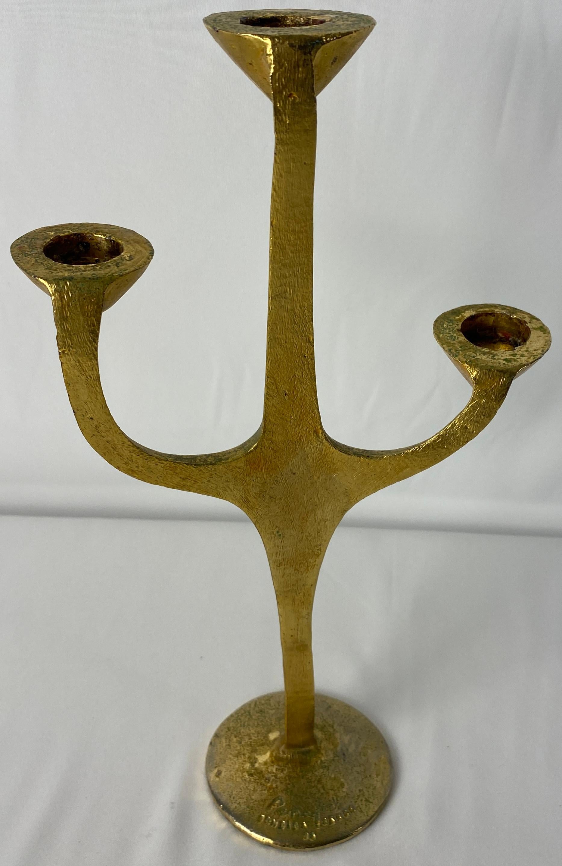 A fine sculptural three-arm bronze candle holder by Carlos Penafiel. 
Signed.

Measures: 11 5/8