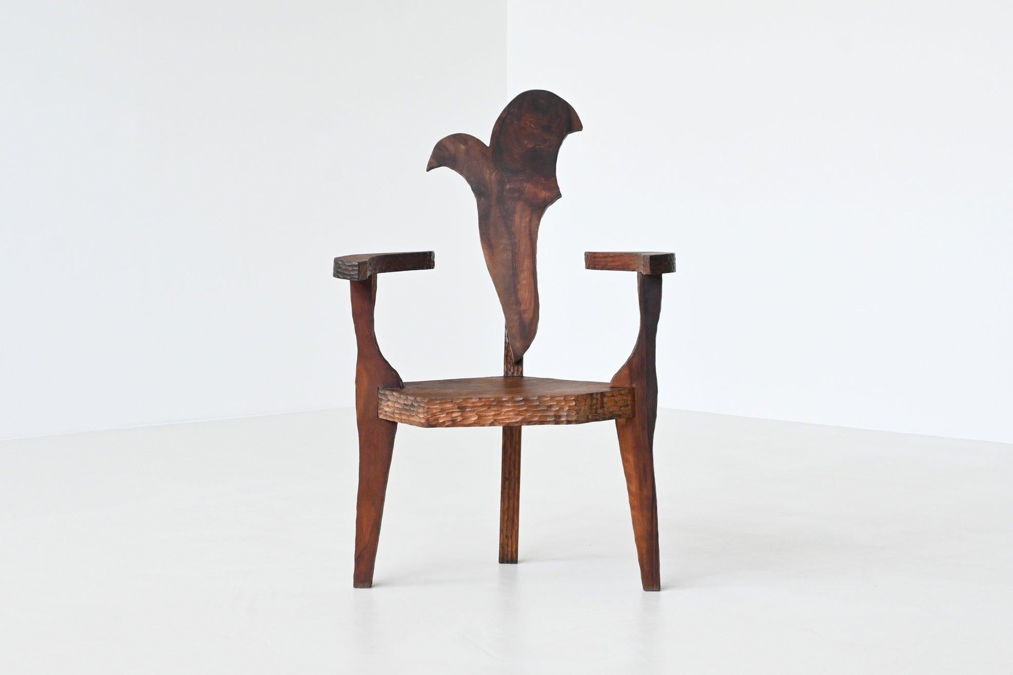 Stunning and unique brutalist armchair by unknown designer or manufacturer, France 1970. This beautifully shaped chair is hand carved from solid tropical hardwood with an amazing grain to it. Very unique and one of a kind. The chair is bought in the