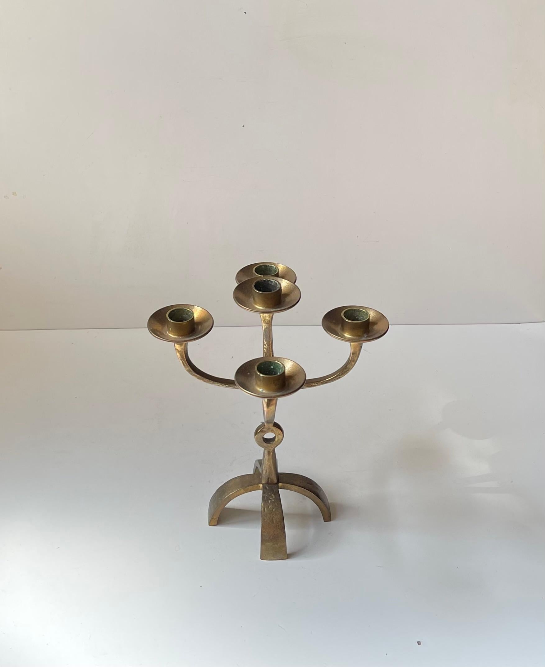 A sculptural candleholder/candelabra cast in washed bronze. It is to be installed with 5 regular sized candles. This design comes from Scandia/Ystad-Metall in Sweden and It was likely designed by either Gunnar Ander or Carl Einar Borgström, who