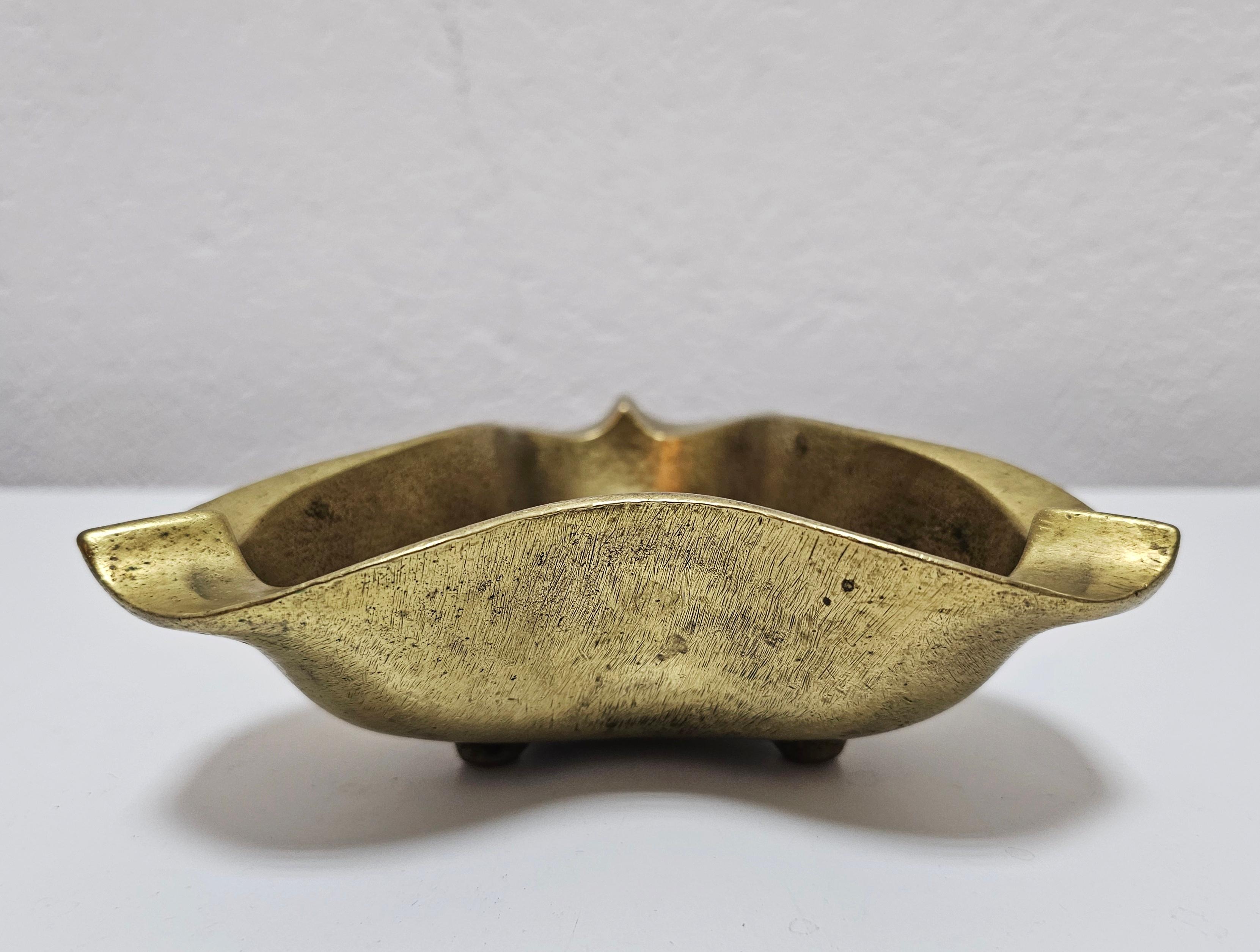In this listing you will find an extremely rare and absolutely extraordinary sculptural Brutalist ashtray for cigars done in bronze. It was designed by Austrian designer Heinz Goll, who's work is often found at auctions in some of the biggest