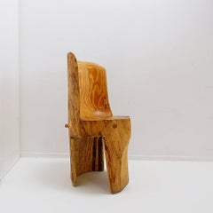 Sculptural brutalist chair in solid oak in wabi-sabi style