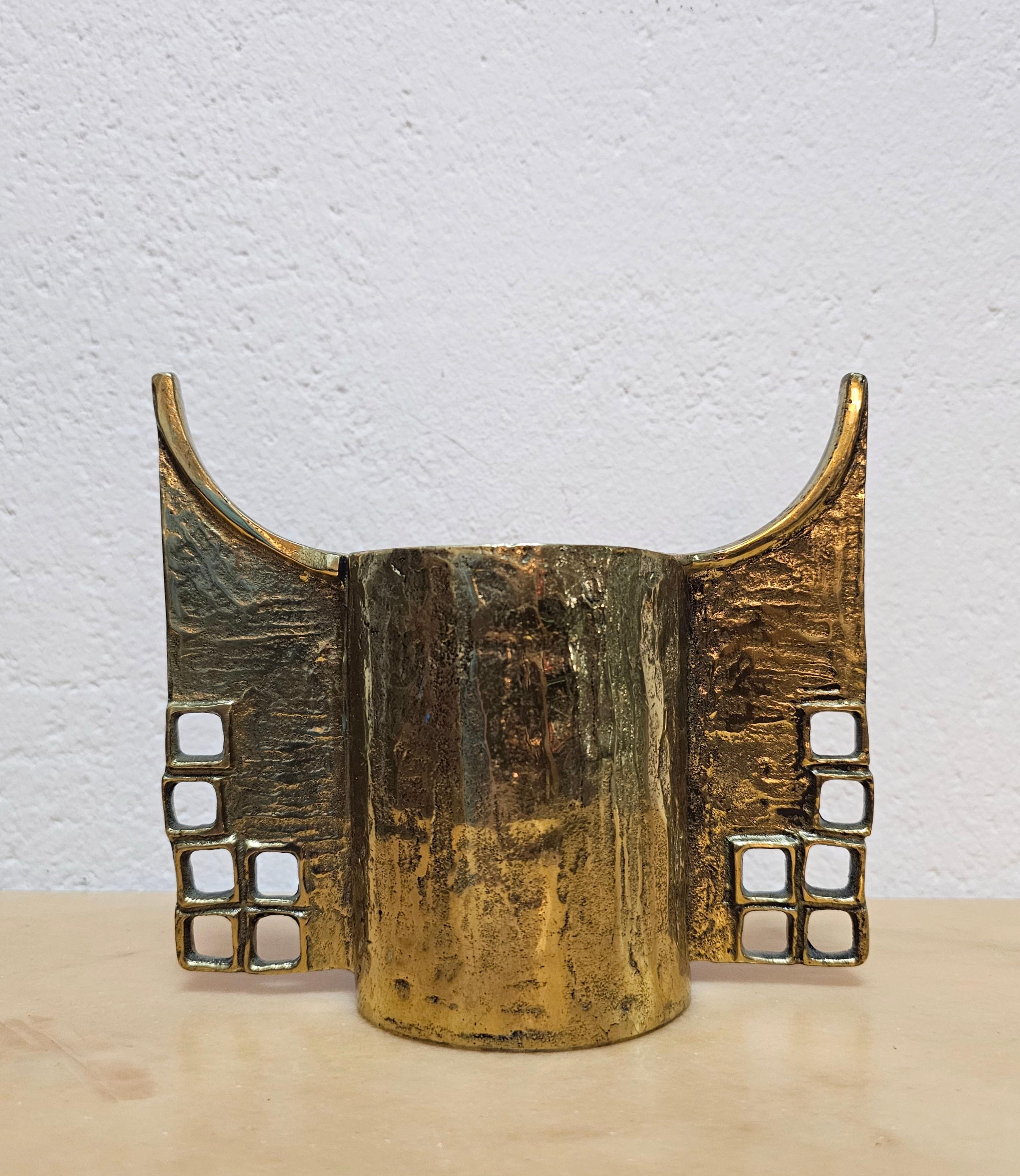 In this listing you will find an extremely rare and absolutely extraordinary sculptural Brutalist candle holder done in gilt bronze. It was designed by Austrian designer Heinz Goll, who's work is often found at auctions in some of the biggest