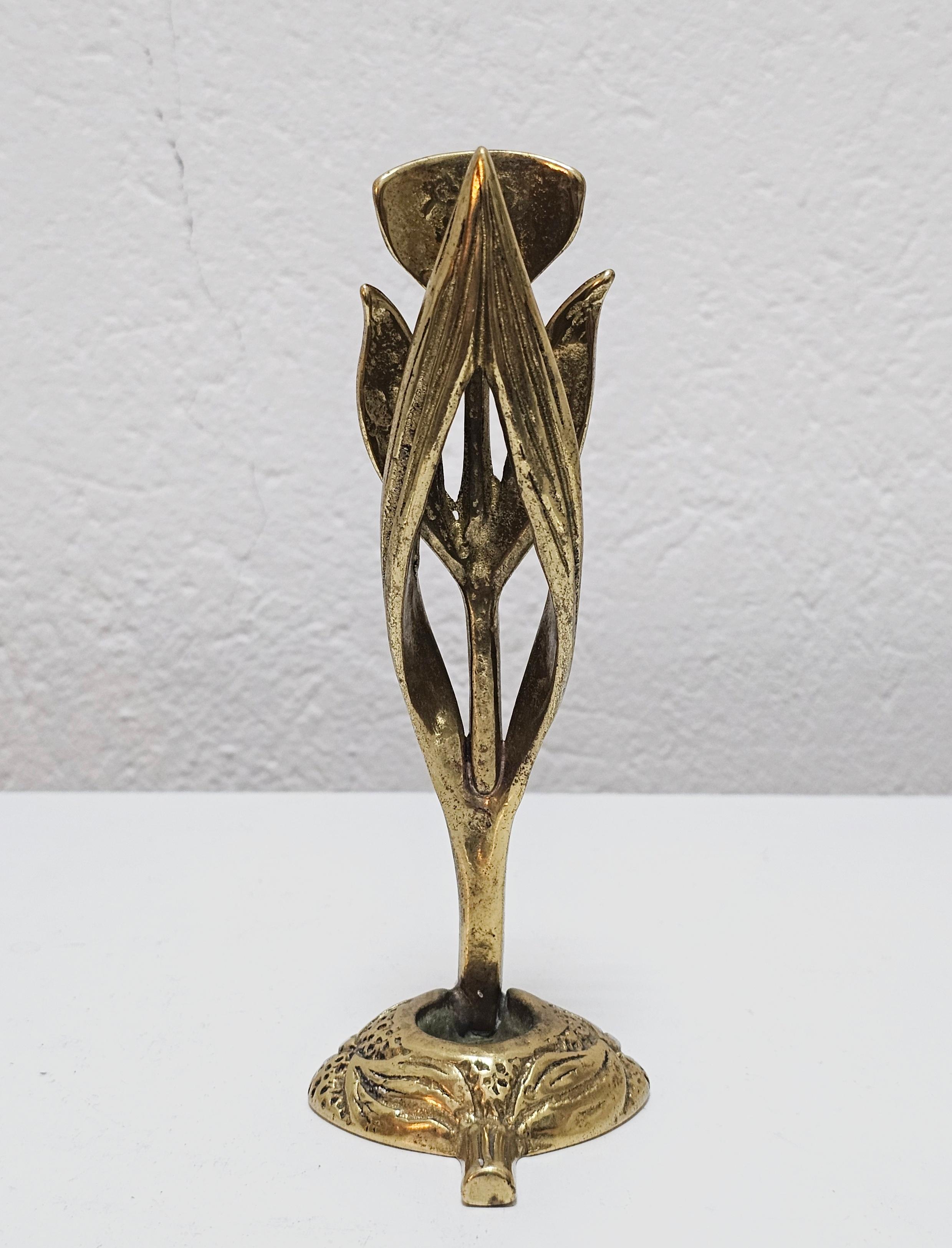 In this listing you will find an extremely rare and absolutely extraordinary sculptural Brutalist candle holder done in gilt bronze, shaped as Iris flower. It was designed by Austrian designer Heinz Goll, who's work is often found at auctions in
