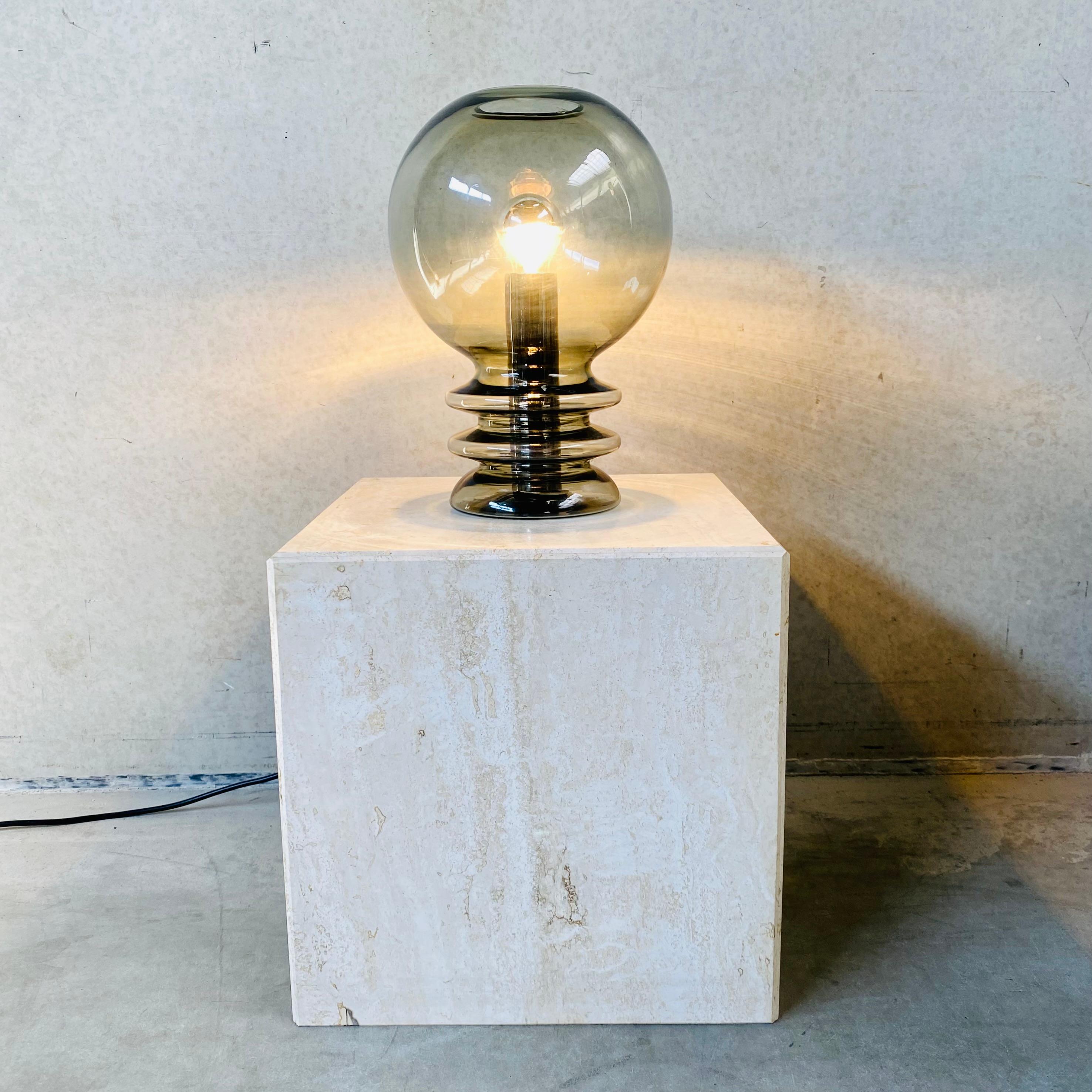Looking for a unique and stylish lighting option that will add character and elegance to your space? Look no further than the vintage Glasshütte Bulb Moon table lamp.

Crafted in the renowned German Glasshütte region, this table lamp boasts a