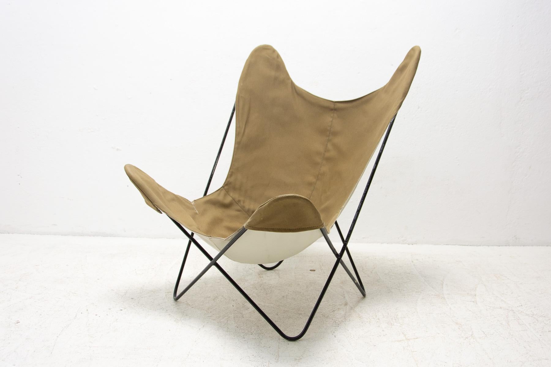 Sculptural butterfly chair originaly designed by Jorge Ferrari-Hardoy. Manufactued in Europe circa 1960´s. This chair has a great patina that you only get with age. Structurally in good condition, the fabric was damaged in one place and now is