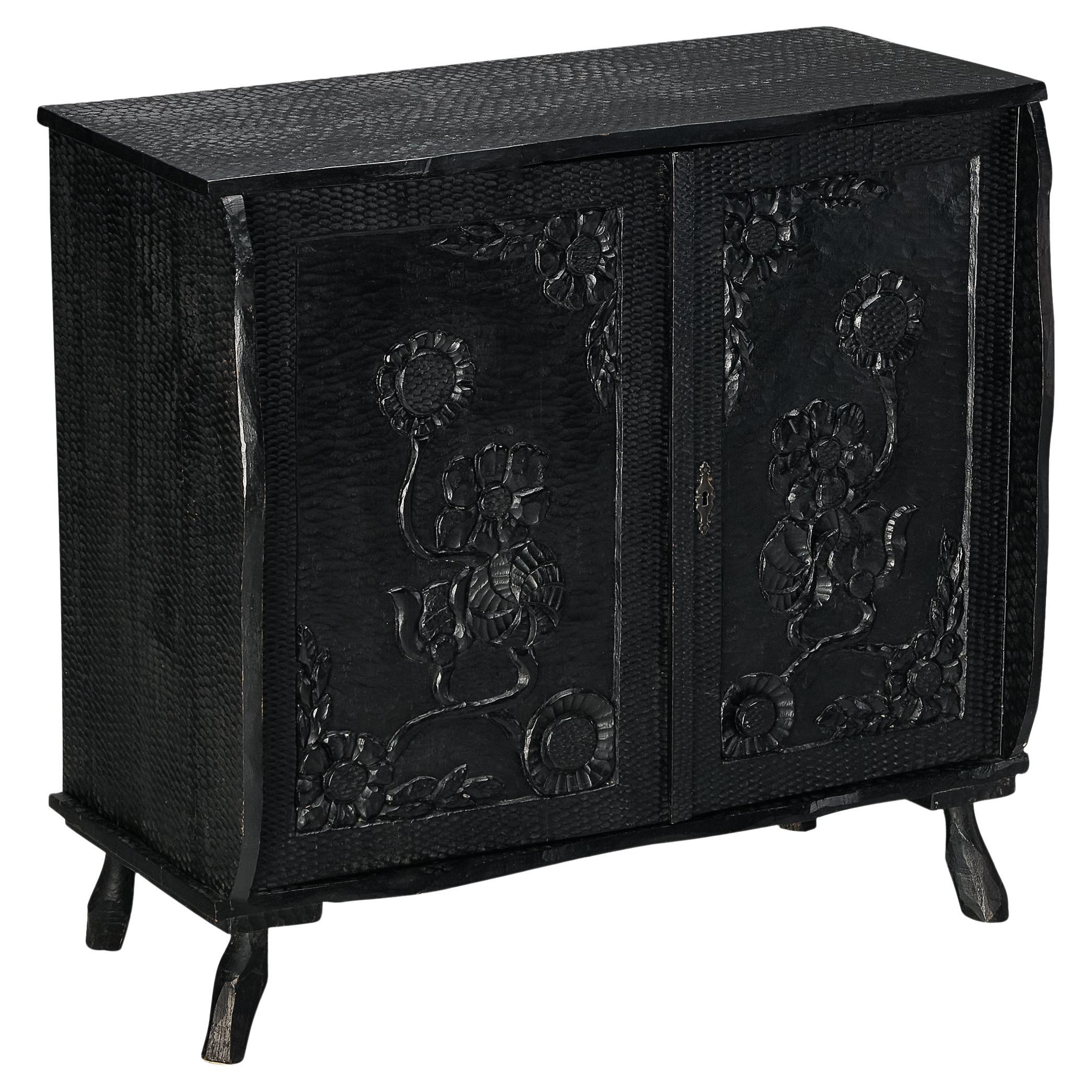 Sculptural Cabinet in Black Lacquered Wood with Decorative Carvings  For Sale