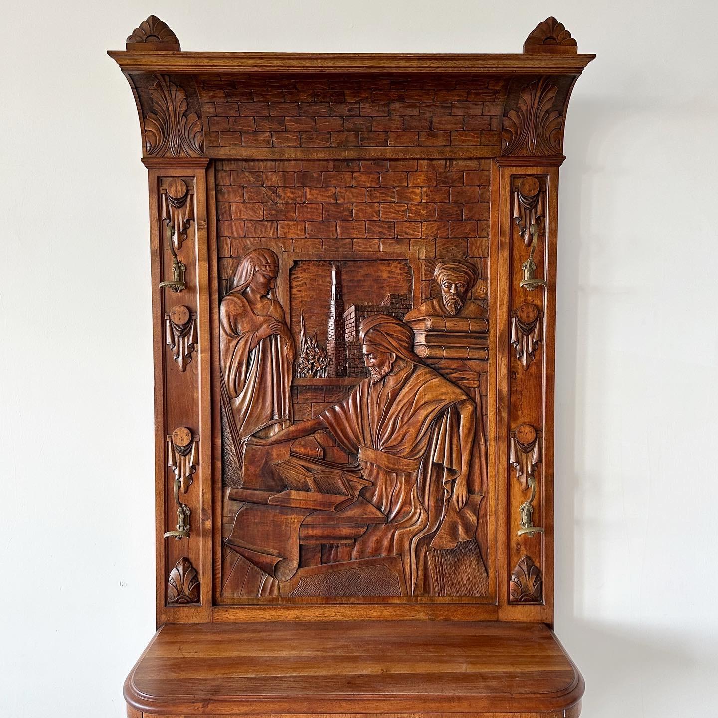 Sculptural carved oak hall tree with four coat hooks and a large waist-height shelf. Not exactly sure what scene is depicted, possibly something Tower of Babel related, maybe Muhammad ibn Musa al-Khwarizmi, the Persian astronomer and mathematician.