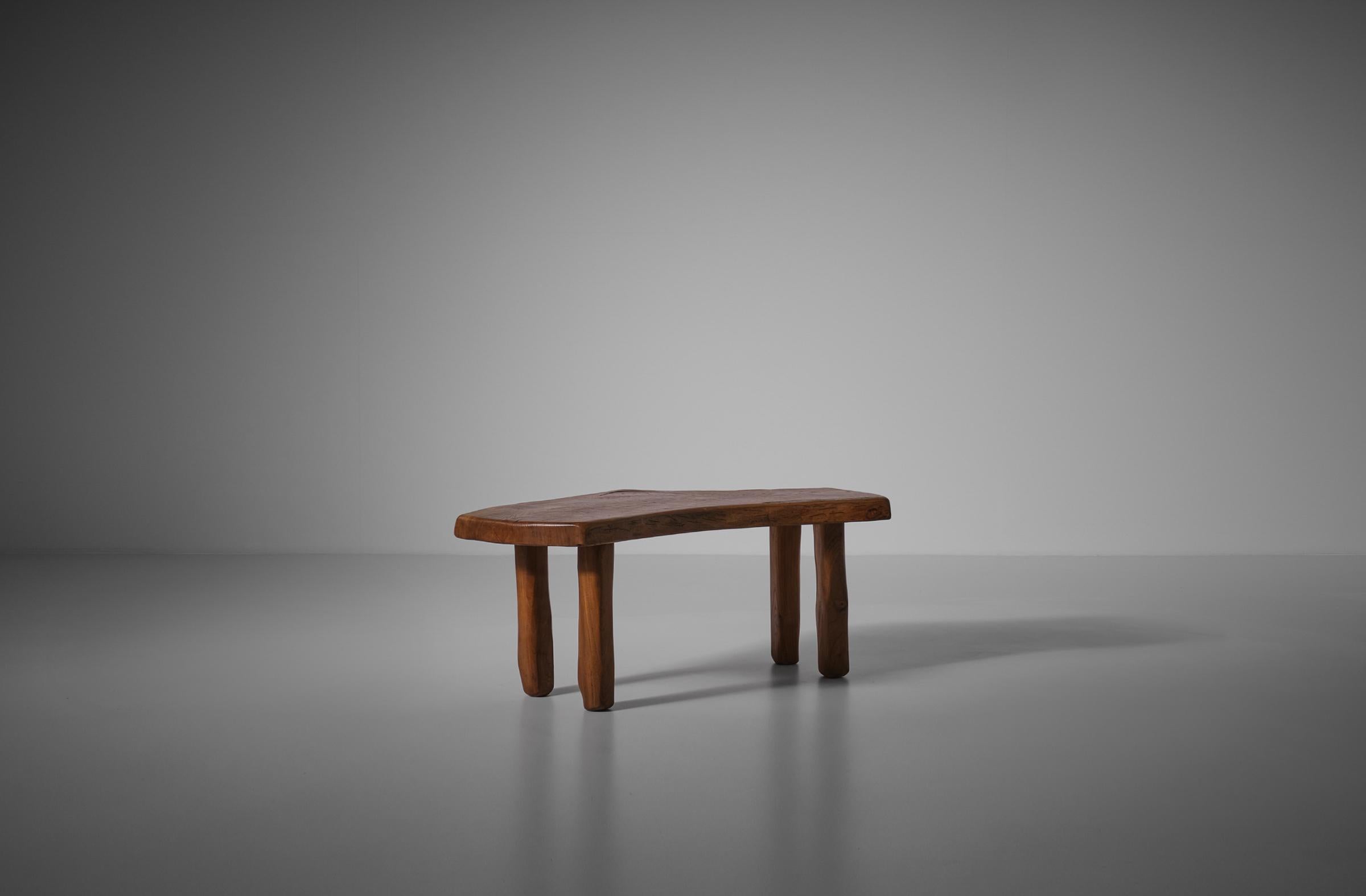 Sculptural Carved wooden table by Charles Flandre, France 1960. Charles Flandre was a woodworker who created sculptural objects and furniture. He is known for his organically shaped and carved objects out of solid wood, the natural shape stands