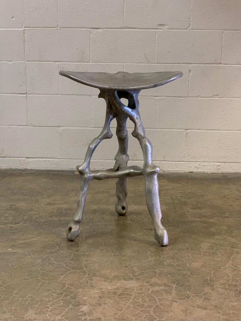 A cast aluminum stool made by west coast artist Denis Wagner, 1970's.