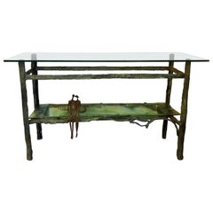 Mesa escultórica de bronce fundido y cristal de Ruth Bloch