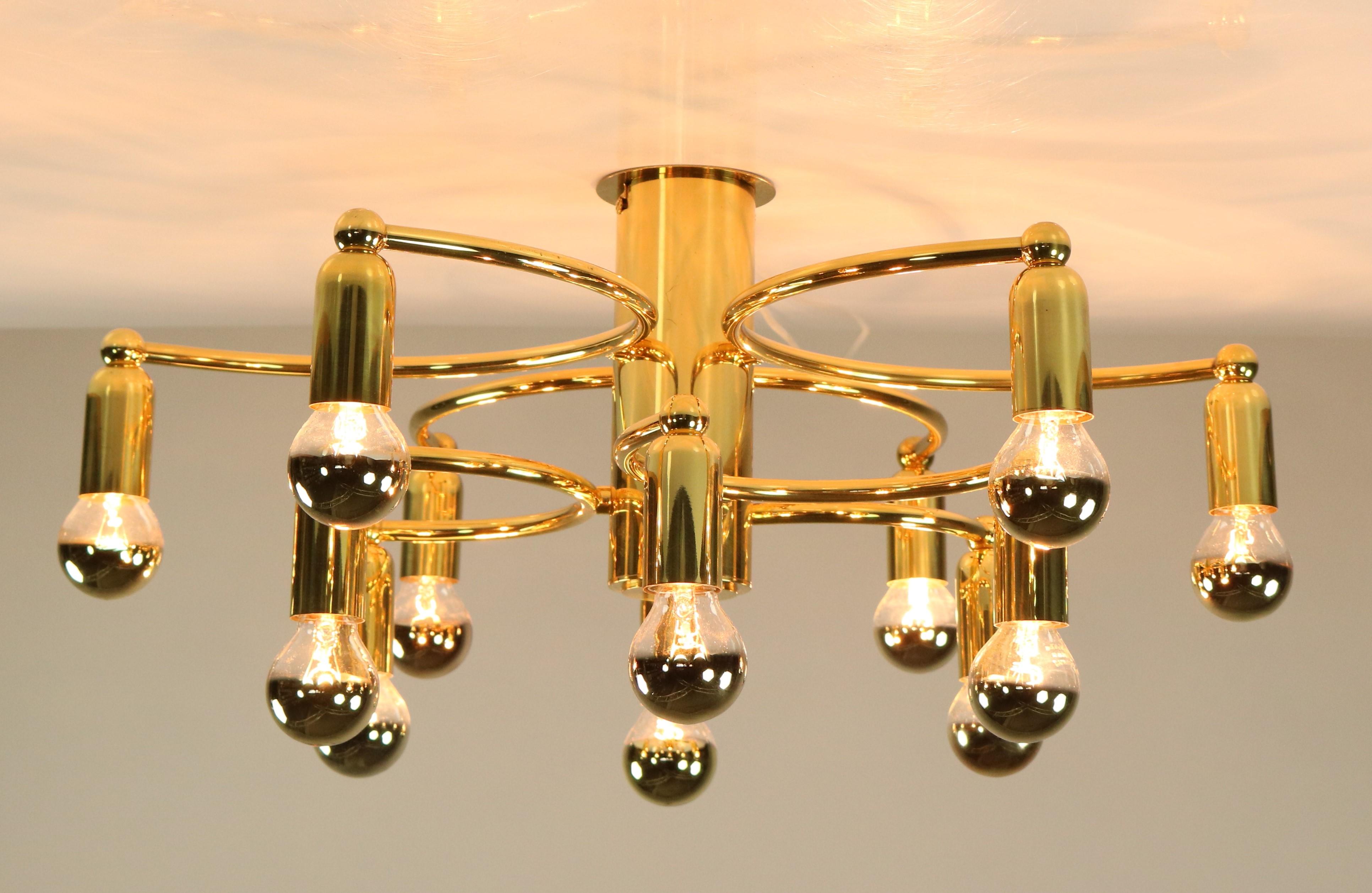 Mid-Century Modern 3 dimensional - sculptural, brass made
flush mount in very fine condition
you need 12 bulbs small Edison screw (E14)
not included in this offer
Measures: Height 8'' without bulbs - diameter 21''.
 