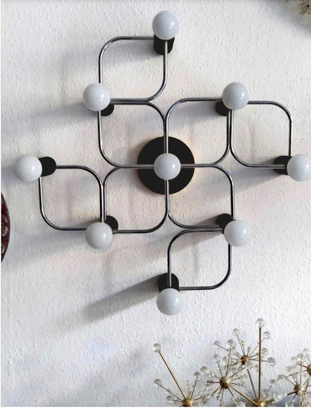 Large sculptural Sciolari style ceiling or wall flush mount by Leola. Black and chrome version.
Germany, 1960s.