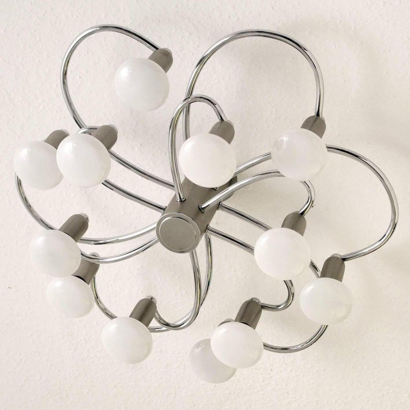 Beautiful sculptural Sciolari / Leola style ceiling or wall flush mount by Helestra,
Germany, 1970s.
Shipping without bulbs.