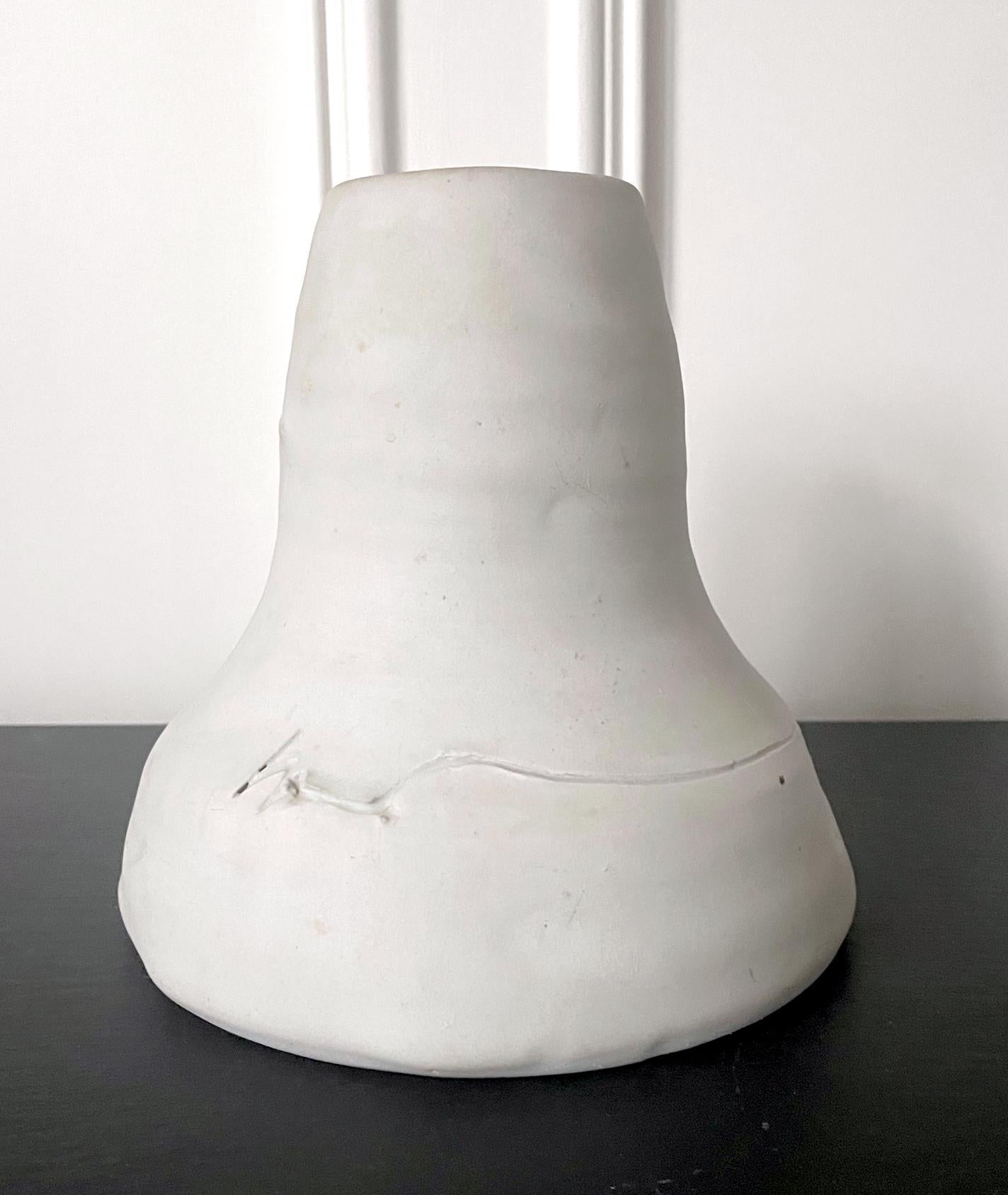 A white stoneware vase by American Ceramist Robert Chapman Turner (1913 - 2005). Made between 1970-80s, the group of white-colored vessels with such a funnel form were called either Beach or Shore, obviously inspired by the ocean. Hand sculptured in