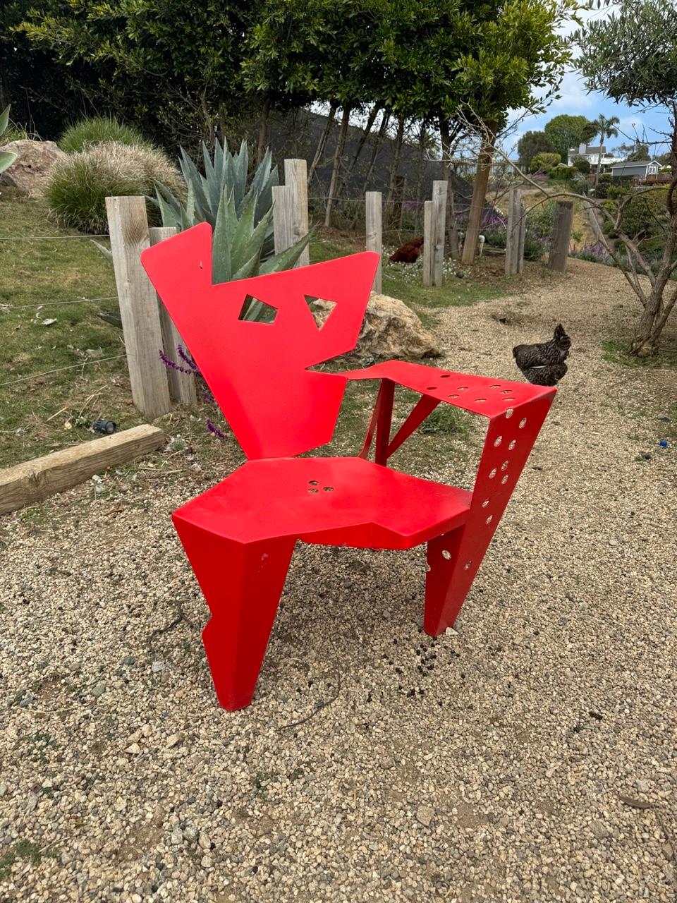 Extraordinary sculptural chair designed by Gerard Coquelin, manufactured in his own atelier, Coquelin Créations, in France in the 1980s. The chair is made of welded red powder-coated metal. An extremely unique chair that as far as I'm aware is a