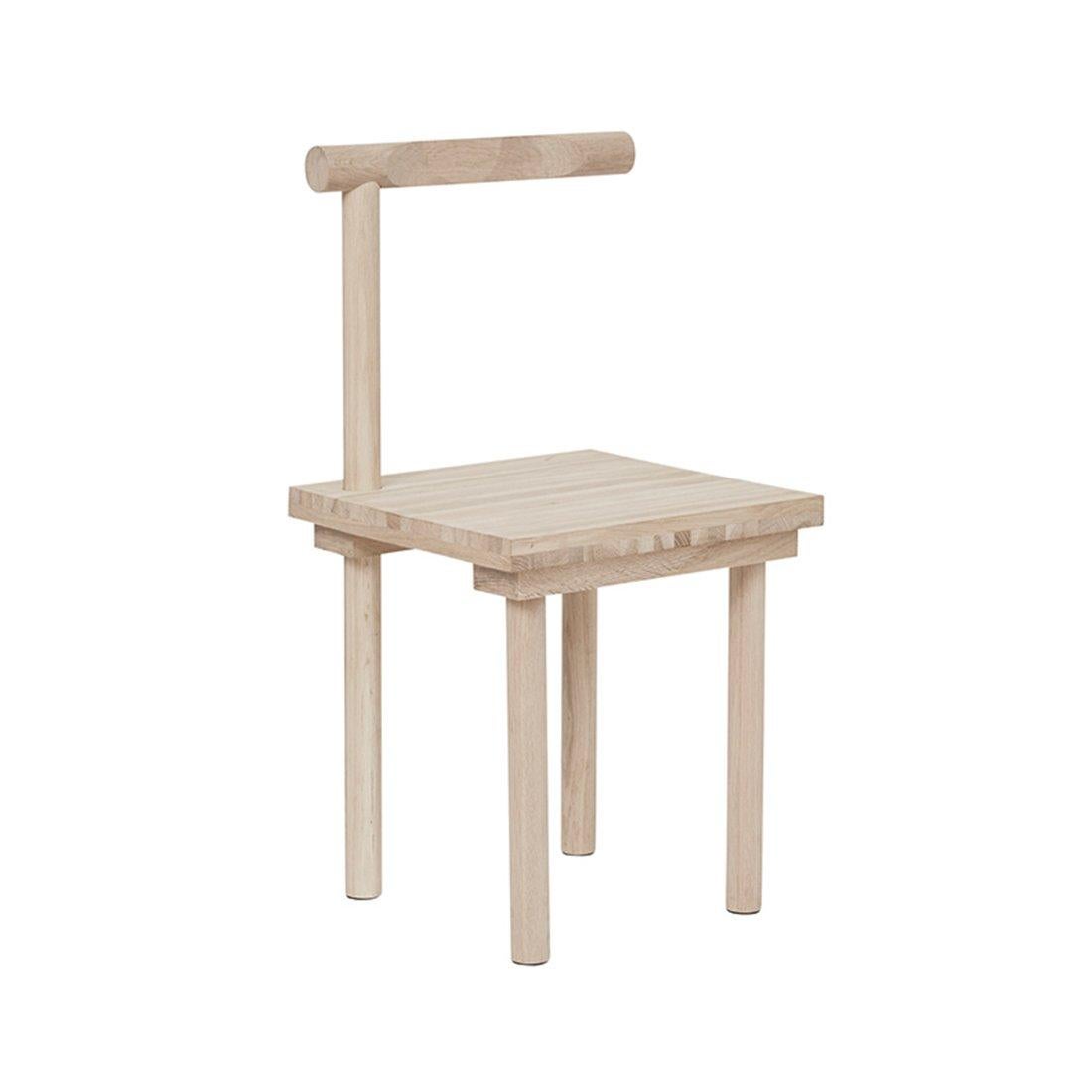 Sculptural chair by Kristina Dam Studio.
Materials: Solid oak with oil treatment.
Dimensions: 42 x 42 x H 80cm.

This piece of furniture is as functional as it’s creative – the Sculptural Chair. Bring a piece of architectural art to your dining