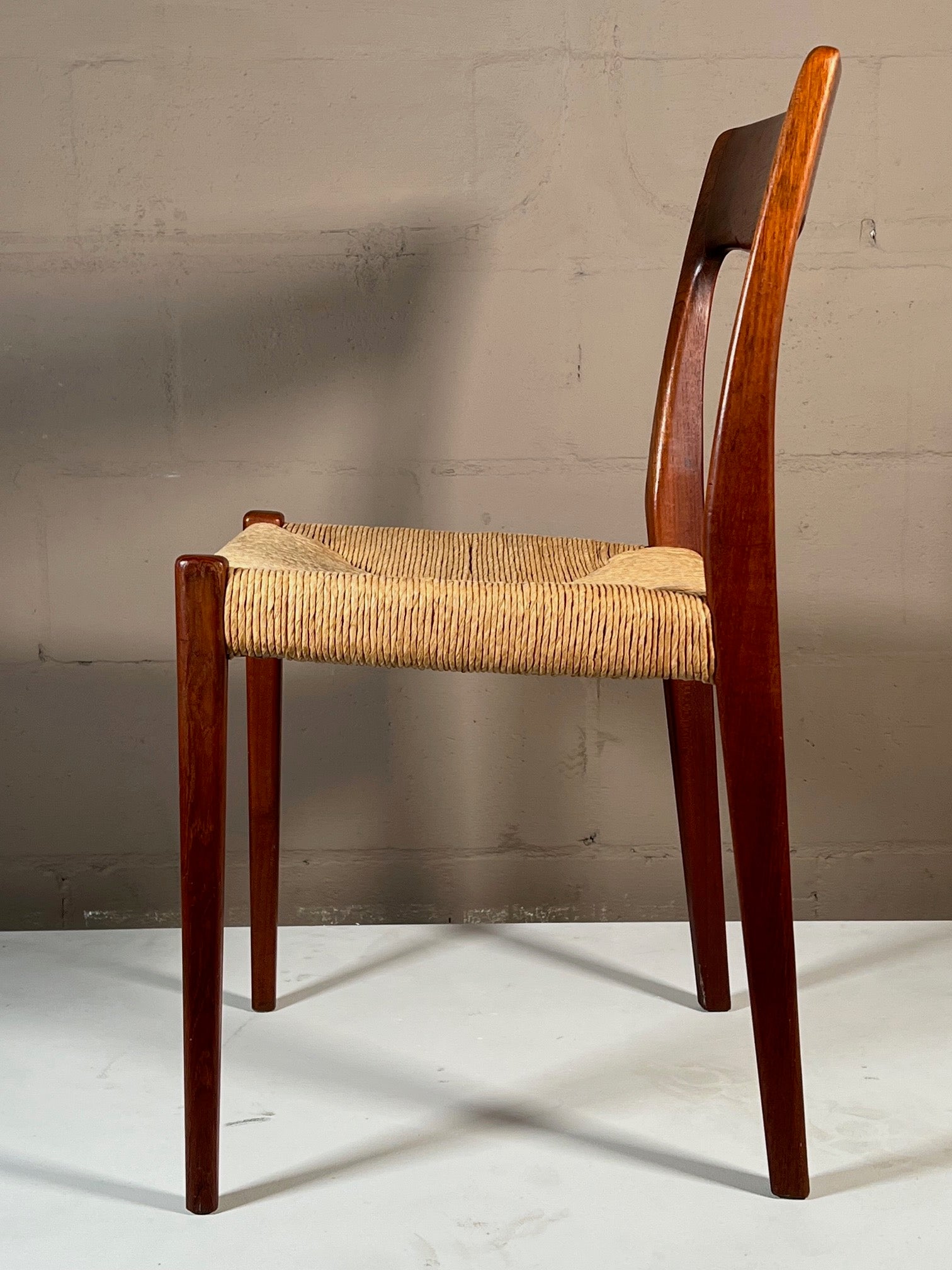 A sculptural, classic Danish style chair by Svegards Markaryd, Sweden, 1950's. Beautiful patina, teak darkened with age. Great details, original papercord seat. This chair looks great from every angle.